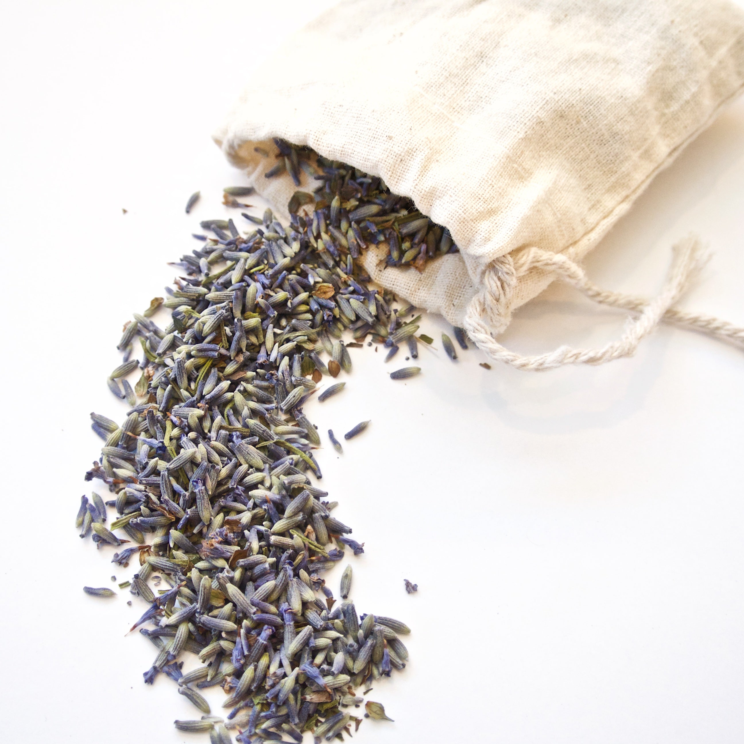 Organic Lavender Sachet made of 100% cotton muslin filled with dried lavender flowers, perfect for calming scent.