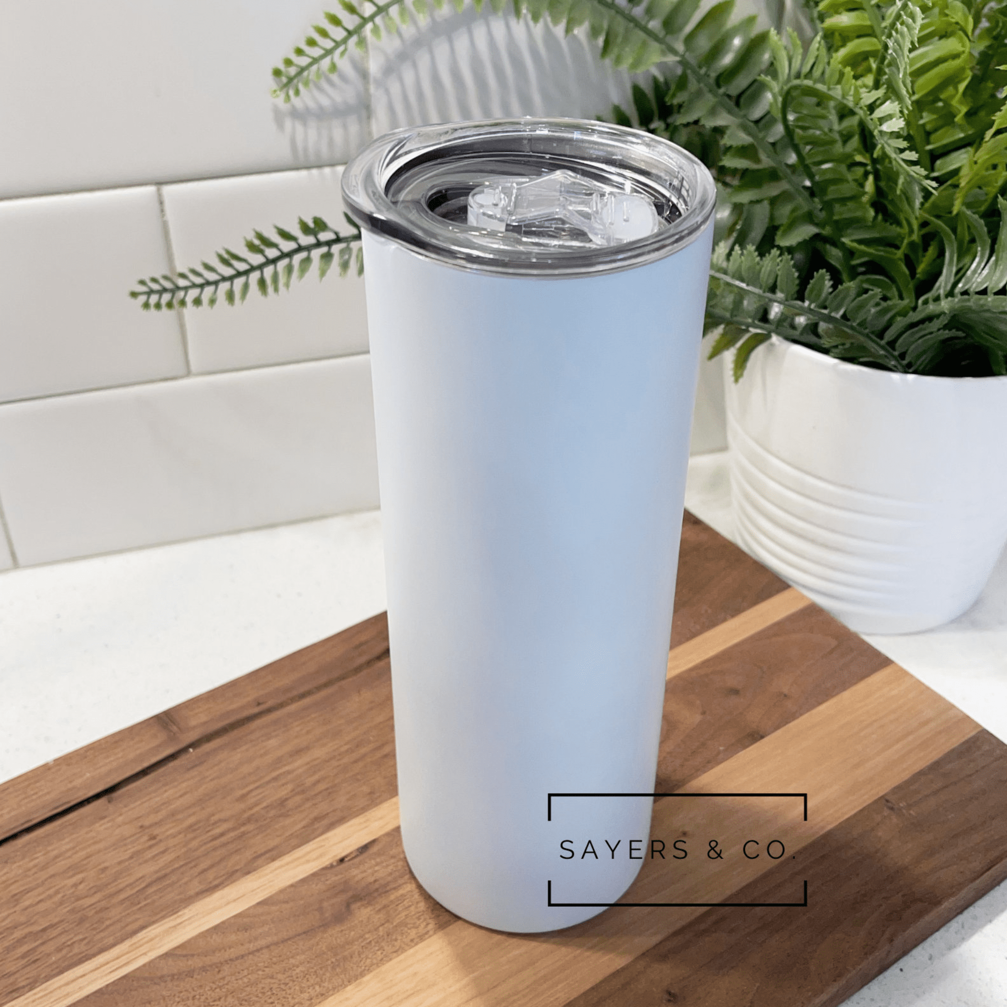 Pack of 20 matte white straight sublimation tumblers with straws and non-slip bottoms, elegantly packaged in white boxes.