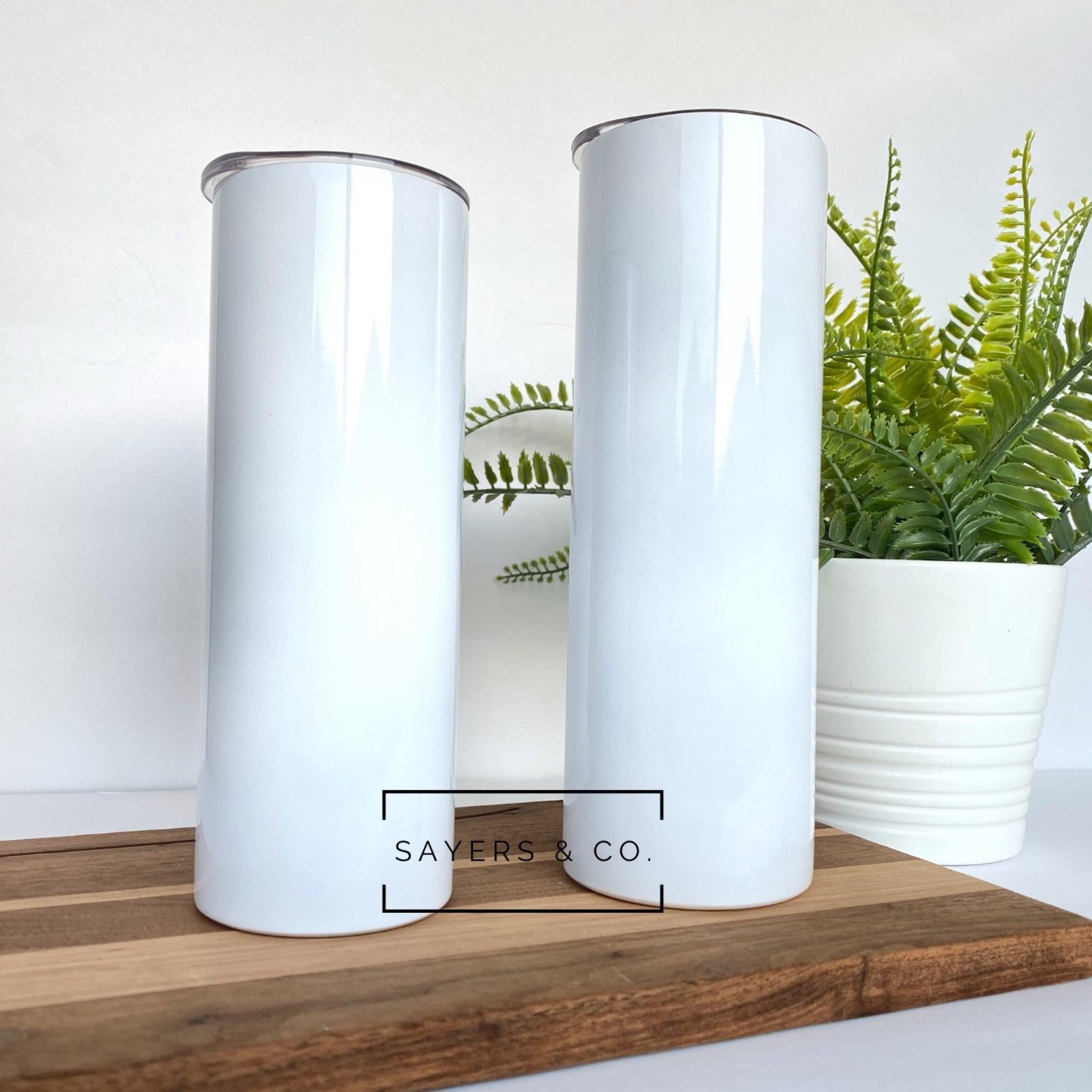 Pack of 20 white skinny straight sublimation tumblers, 20oz and 30oz sizes, with straws and individual white boxes.