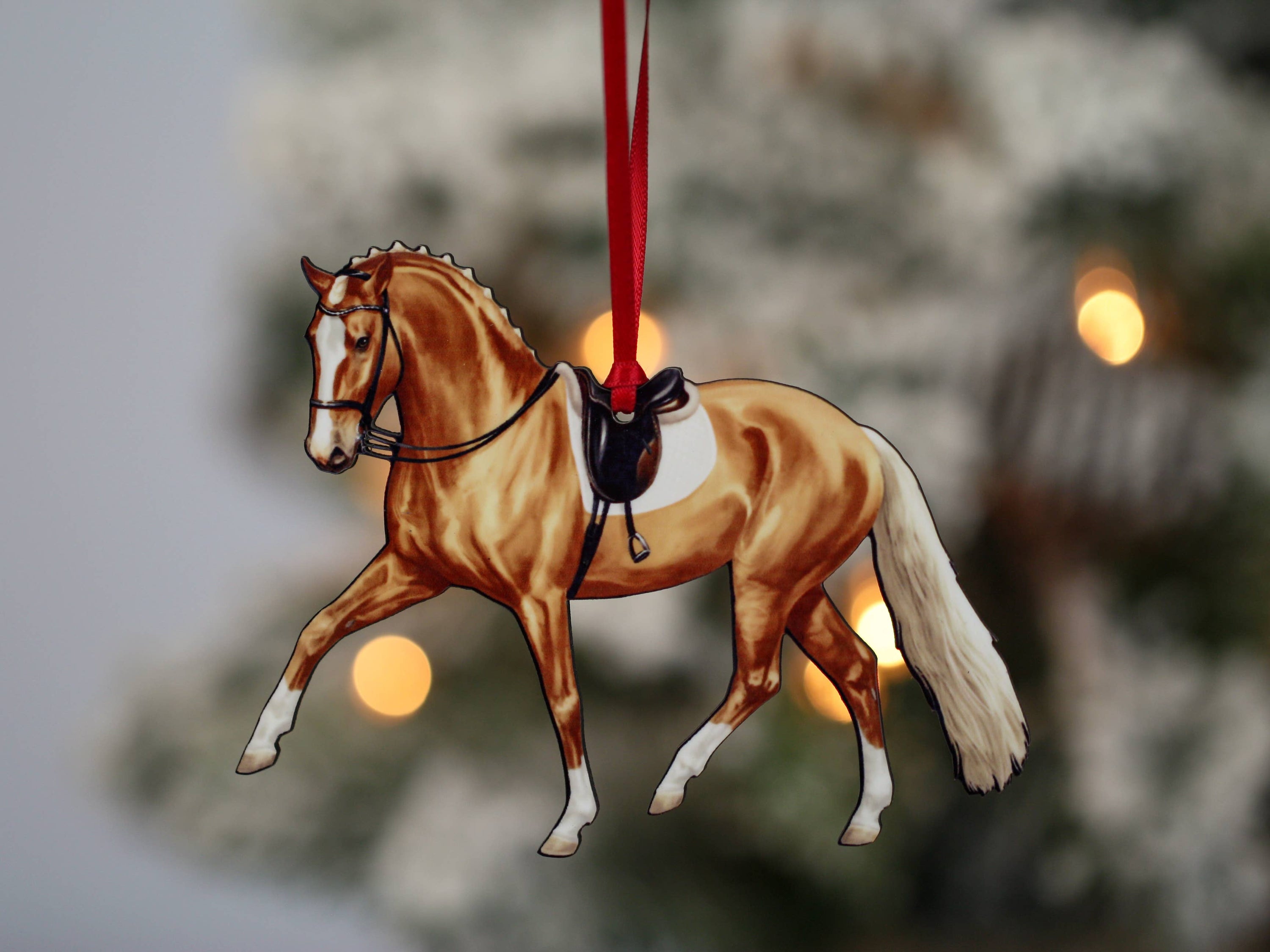 Palomino Dressage Horse Ornament showcasing half pass movement, handmade from composite wood with glossy finish.