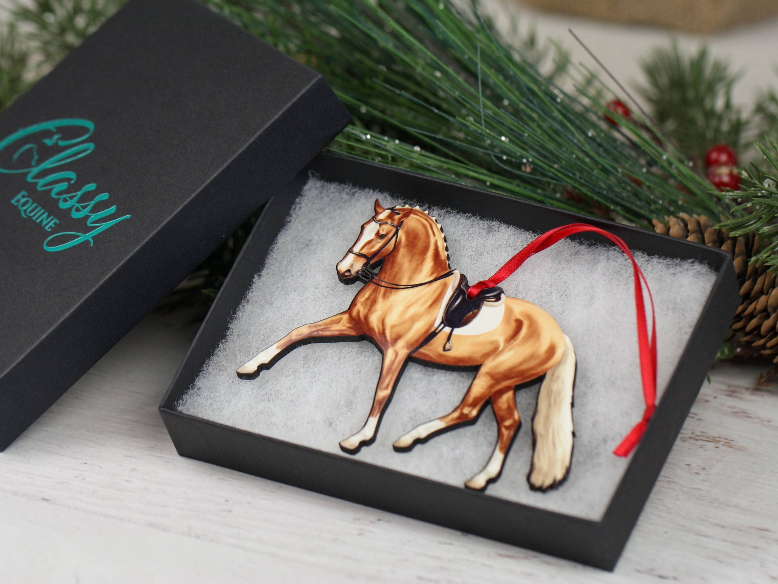 Palomino Dressage Horse Ornament showcasing half pass movement, handmade from composite wood with glossy finish.