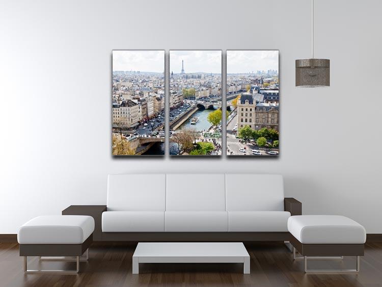Three-panel canvas print showcasing the Paris skyline from Notre Dame, featuring vibrant colors and intricate details.