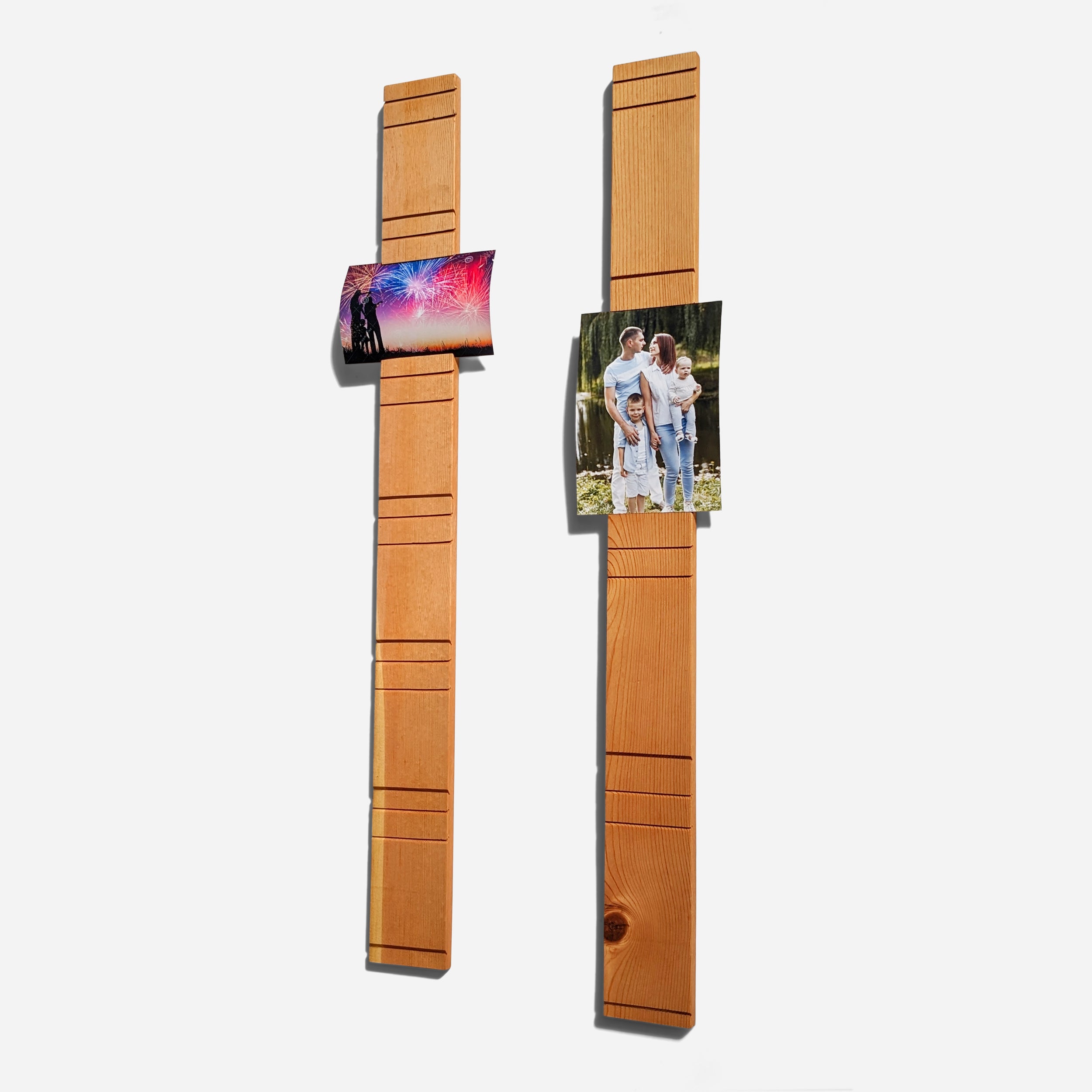A contemporary wall-mounted photo holder made from sustainable wood, showcasing four photo slots for 3" x 5" or 4" x 6" pictures.
