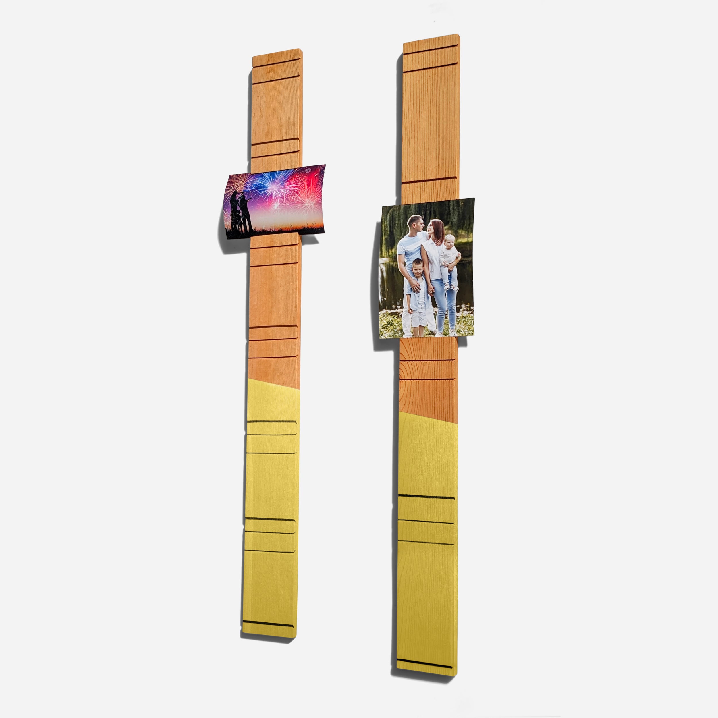 A contemporary wall-mounted photo holder made from sustainable wood, showcasing four photo slots for 3" x 5" or 4" x 6" pictures.
