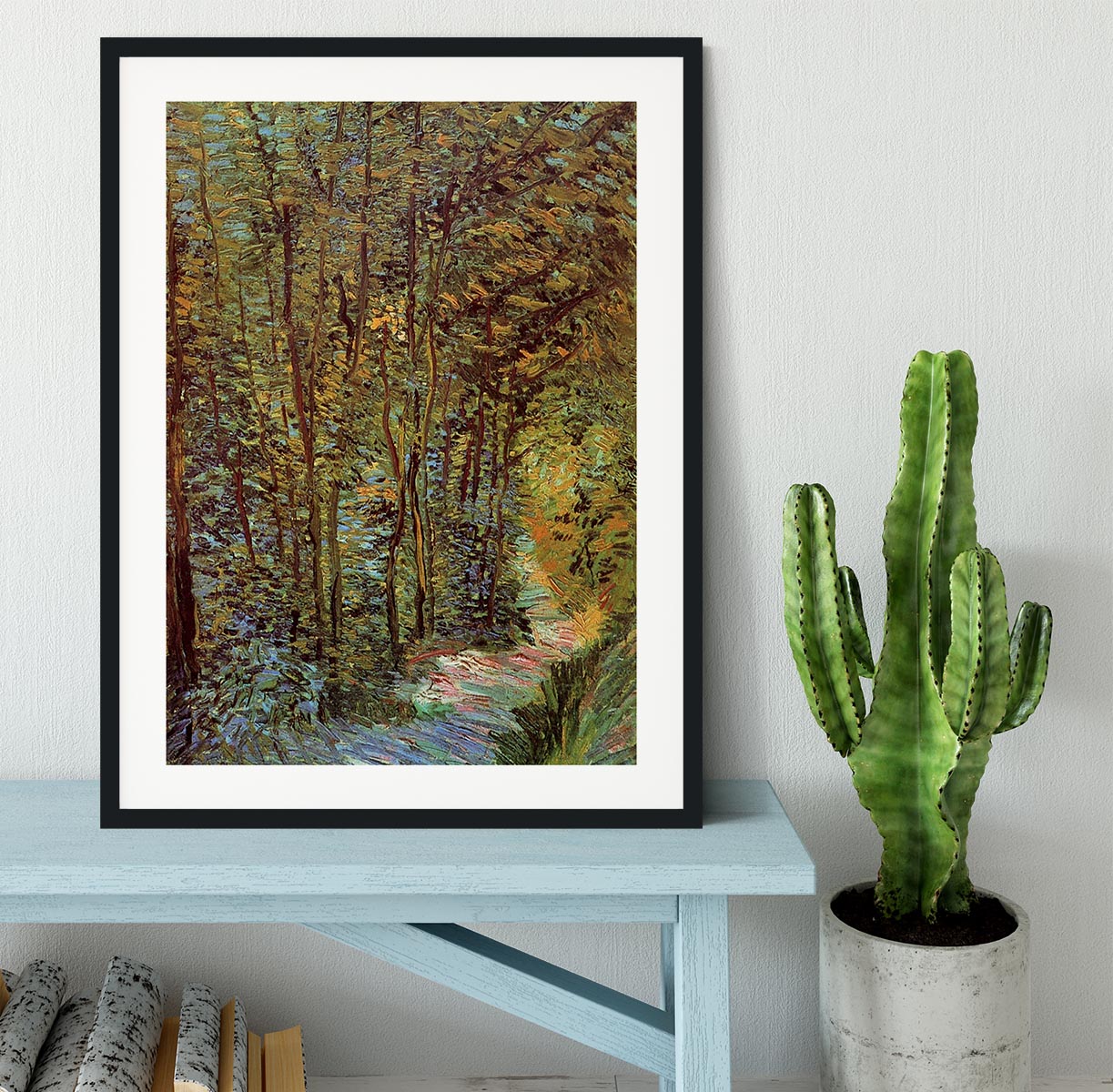 Framed print of Van Gogh's 'Path in the Woods', showcasing vibrant colors and intricate details in a stylish frame.