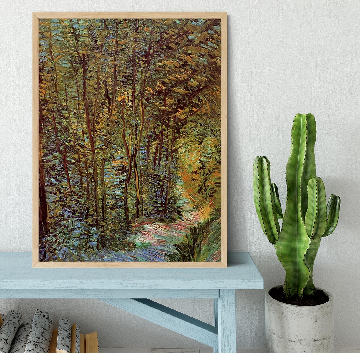 Framed print of Van Gogh's 'Path in the Woods', showcasing vibrant colors and intricate details in a stylish frame.