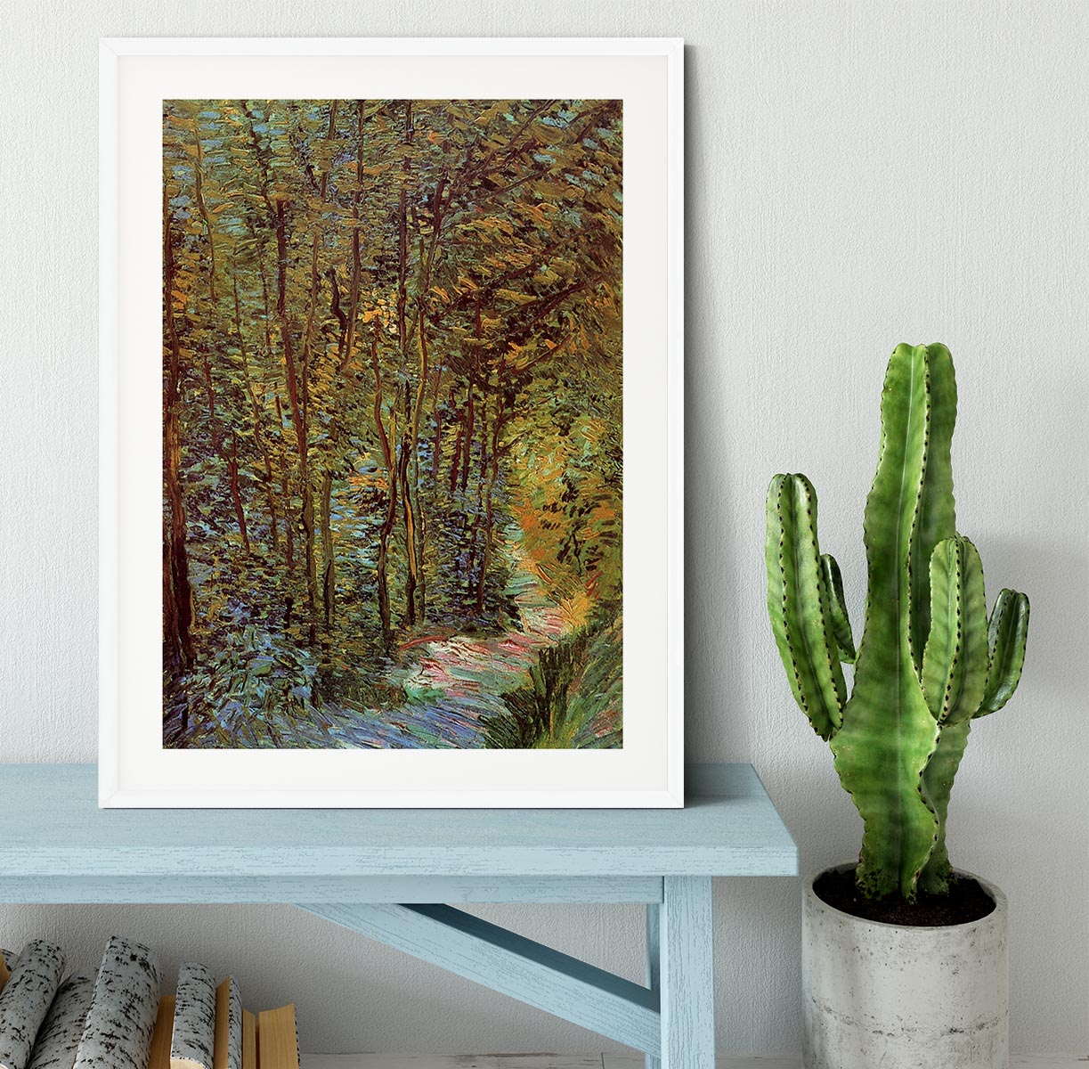 Framed print of Van Gogh's 'Path in the Woods', showcasing vibrant colors and intricate details in a stylish frame.