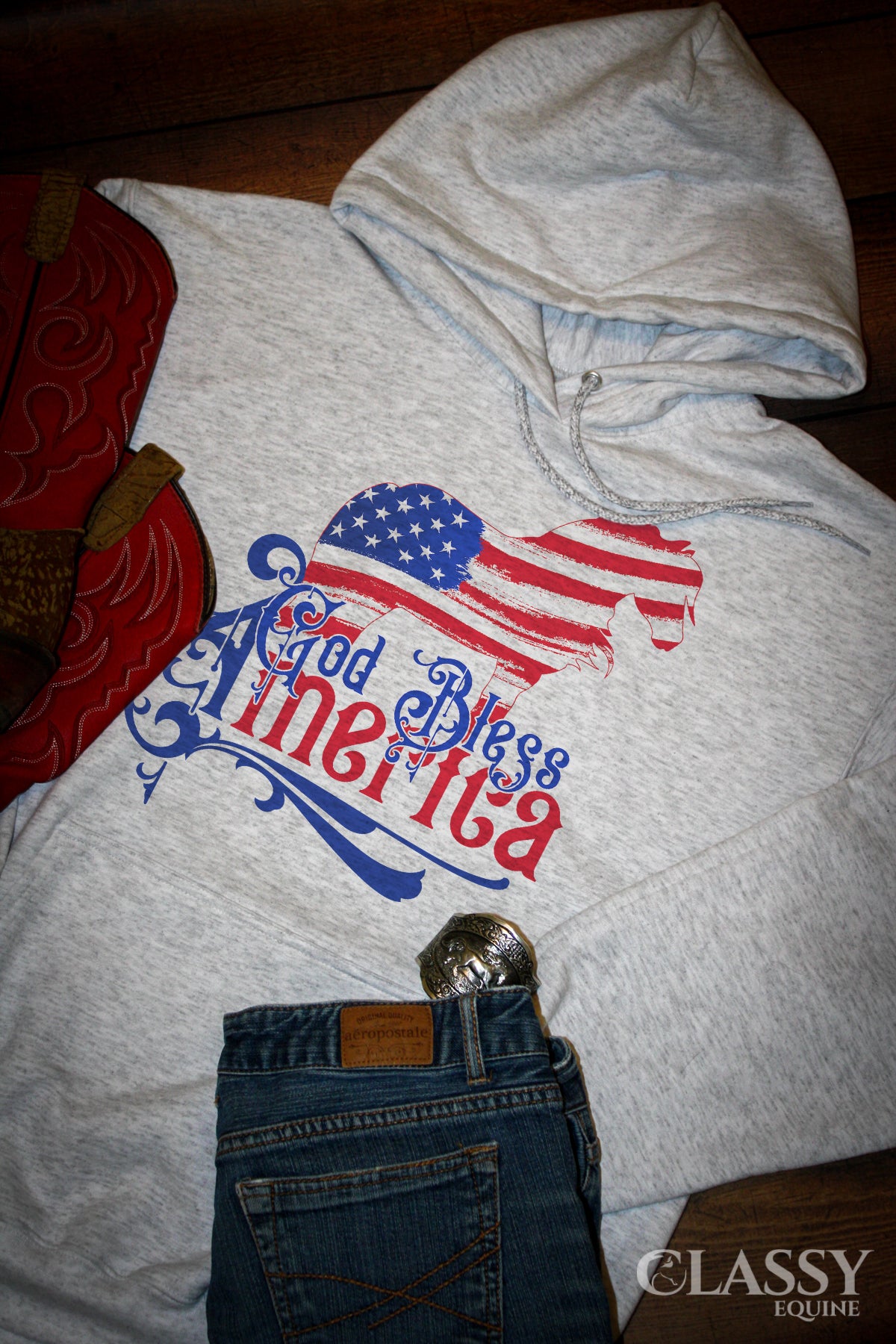 A cozy God Bless America Hooded Sweatshirt featuring a patriotic Gypsy design, perfect for casual wear.