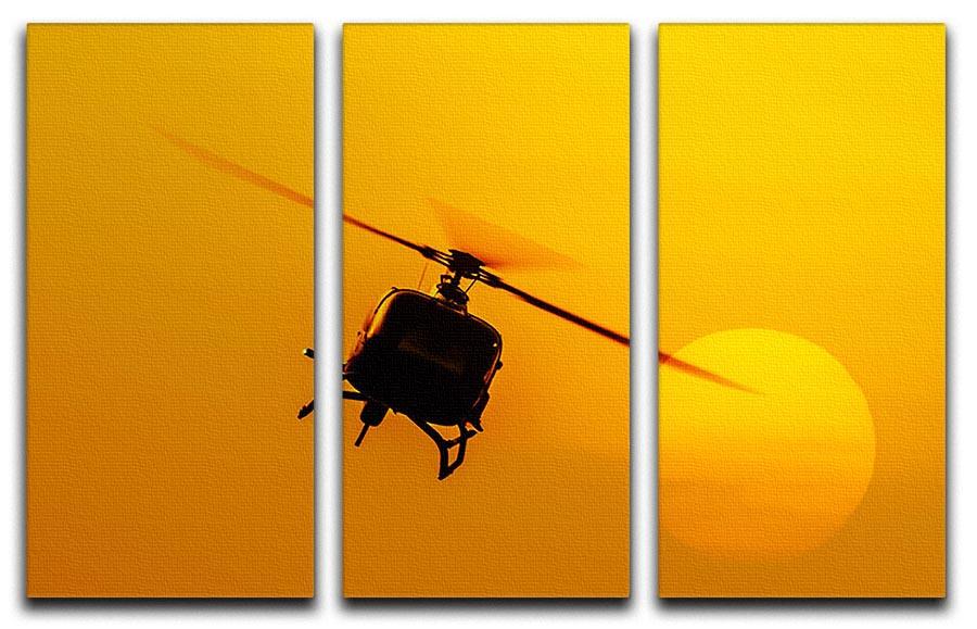 A stunning 3-panel canvas print depicting a patrol helicopter flying against a vibrant sunset, perfect for home decor.