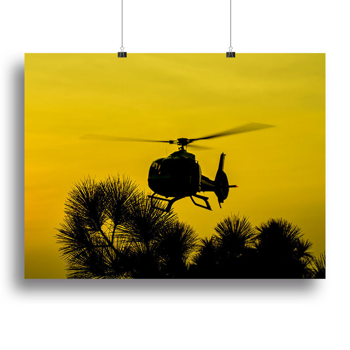 A stunning canvas print of a Patrol Helicopter flying in a clear blue sky, showcasing vibrant colors and intricate details.