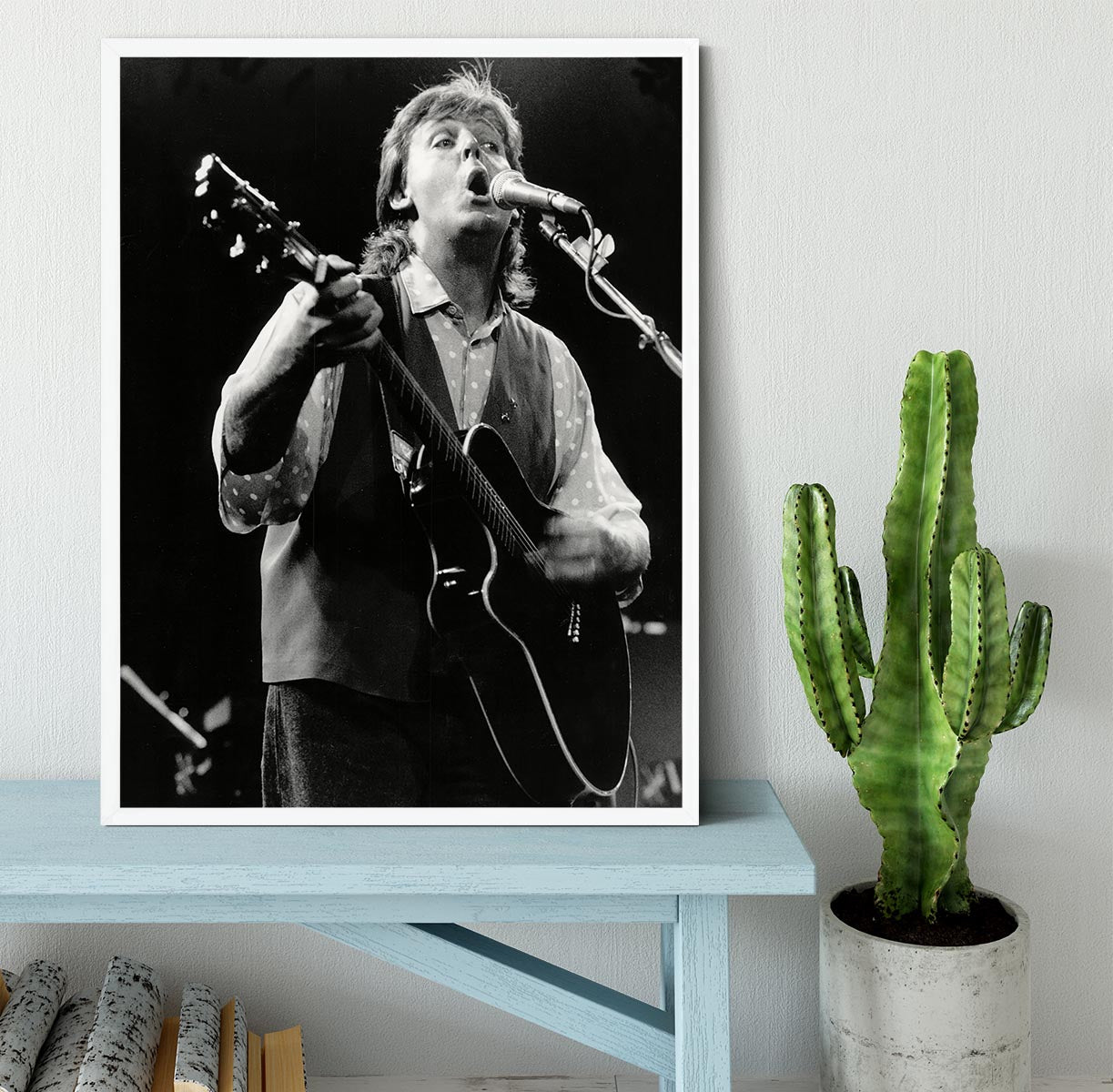 Framed print of Paul McCartney performing on stage in 1989, showcasing vibrant colors and high-quality craftsmanship.