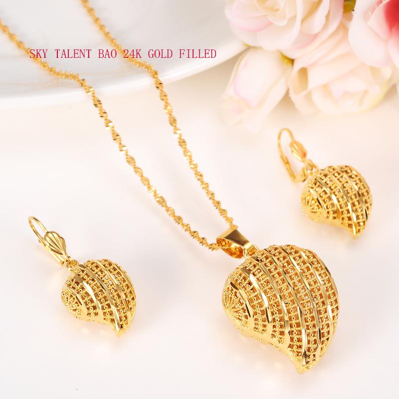 Elegant Peach Heart Pendant Jewelry Set featuring a necklace and earrings in 24k gold, beautifully designed for women.