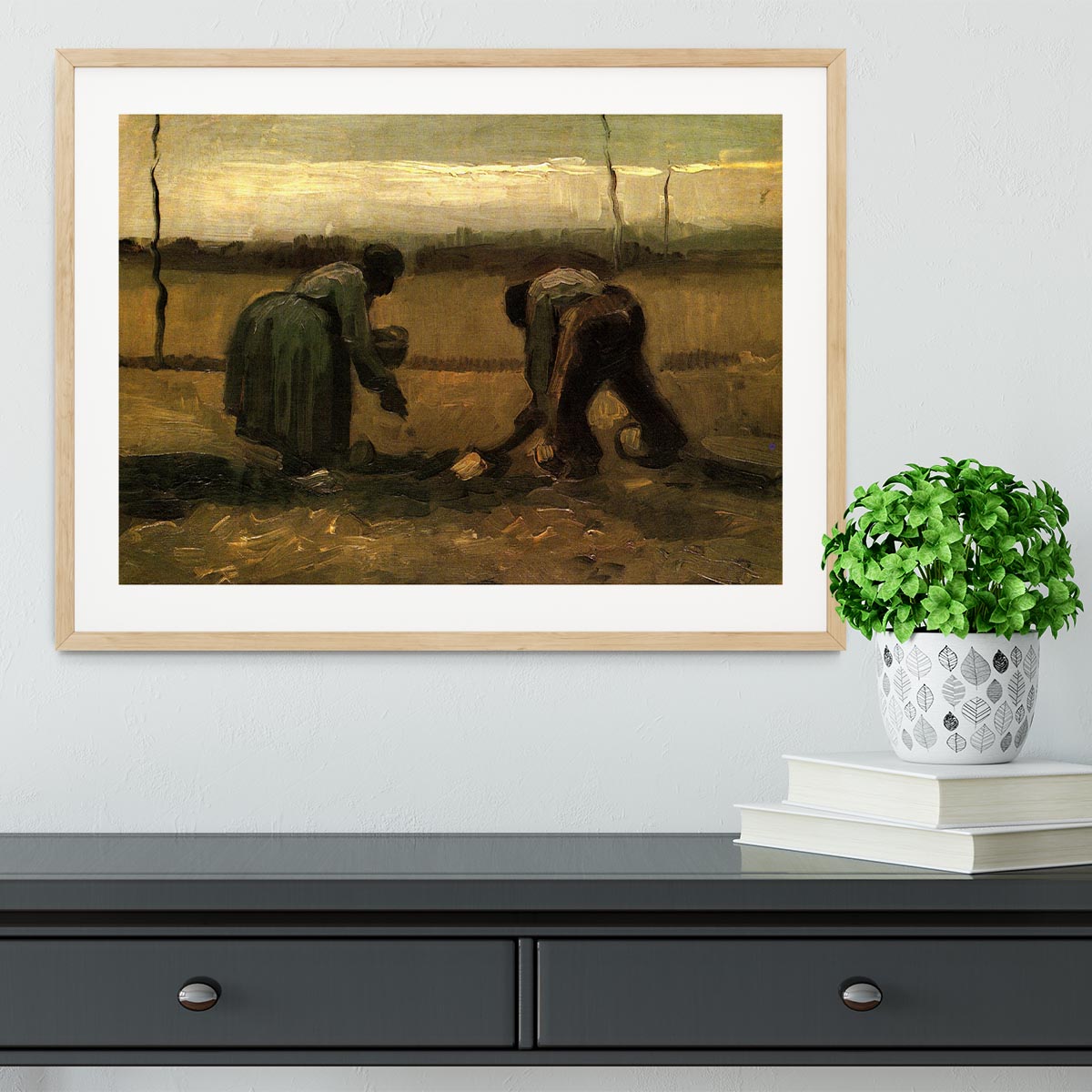 Framed print of Van Gogh's Peasant and Peasant Woman Planting Potatoes, showcasing vibrant colors and intricate details.