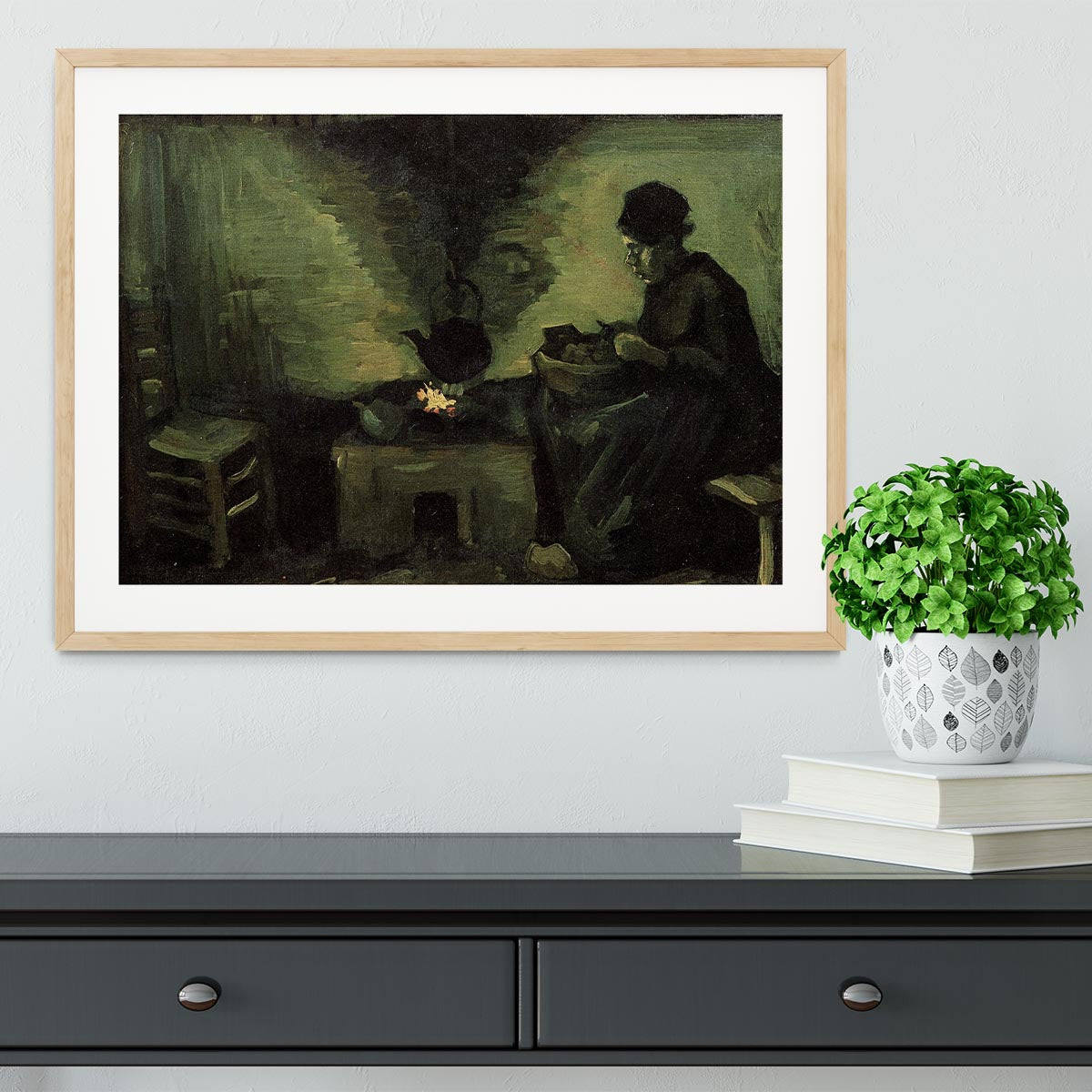 Framed print of Van Gogh's Peasant Woman by the Fireplace, showcasing vibrant colors and intricate details.