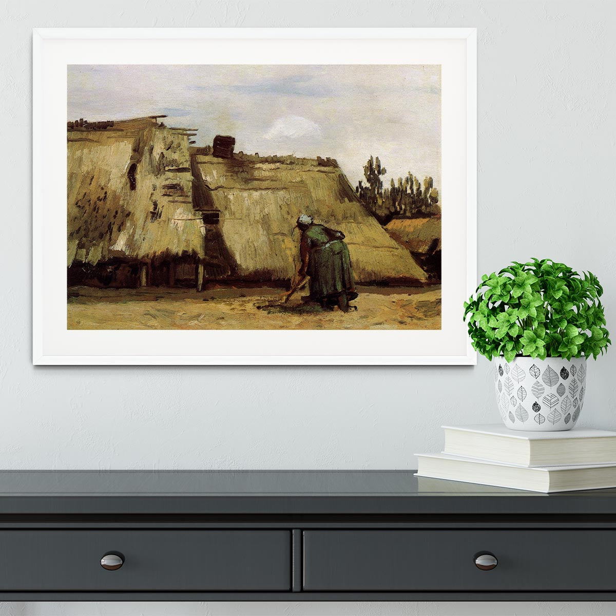 Framed print of Van Gogh's Peasant Woman Digging, showcasing vibrant colors and intricate details.