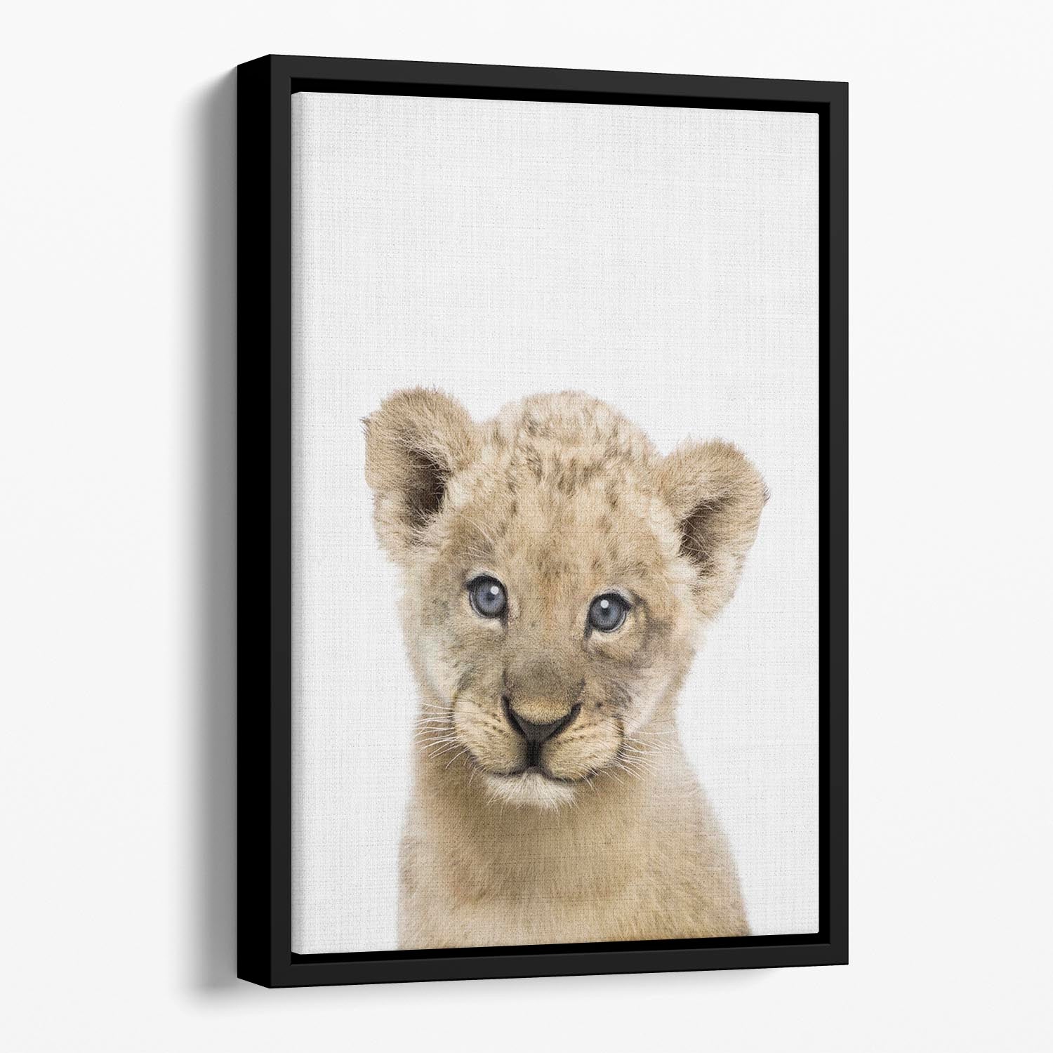 A vibrant abstract canvas featuring a playful baby lion, elegantly framed in a floating wooden frame.