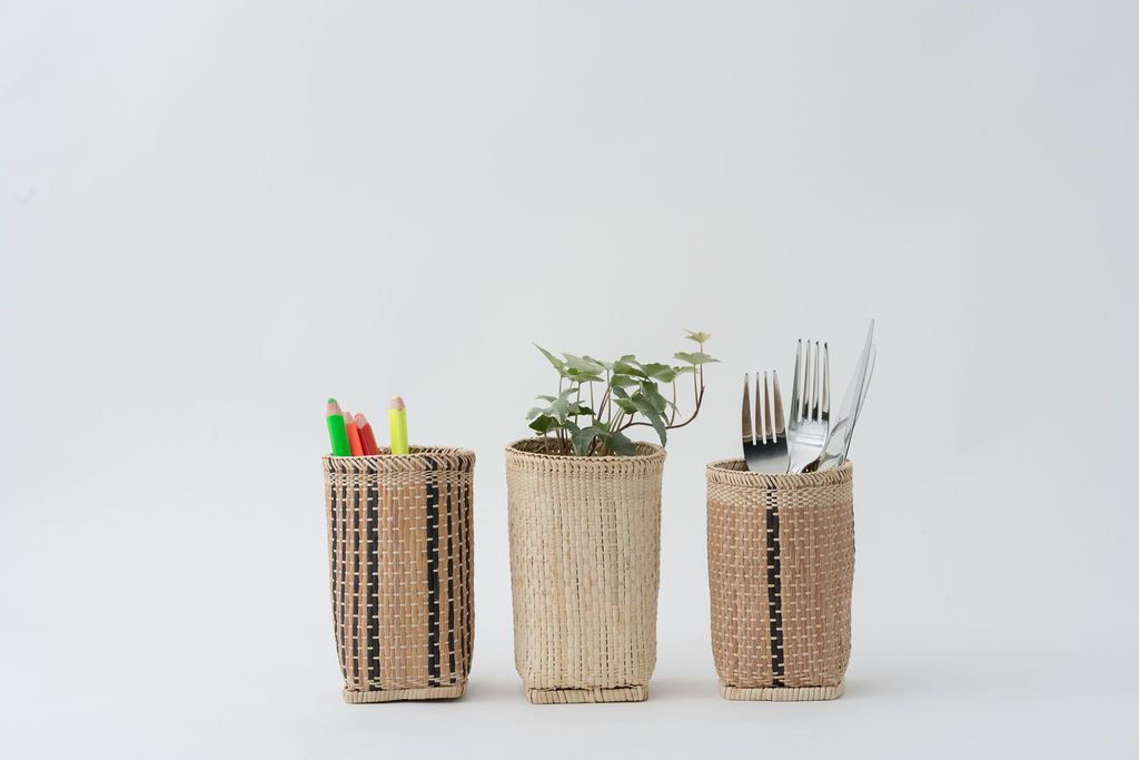 A beautifully handcrafted Pencil Holder Basket made from natural rattan, featuring intricate patterns by Bidayuh artisans, perfect for stationery or small plants.