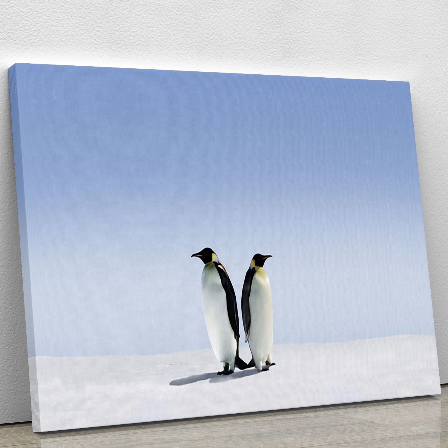 A charming canvas print featuring playful penguins in a whimsical setting, perfect for home decor.
