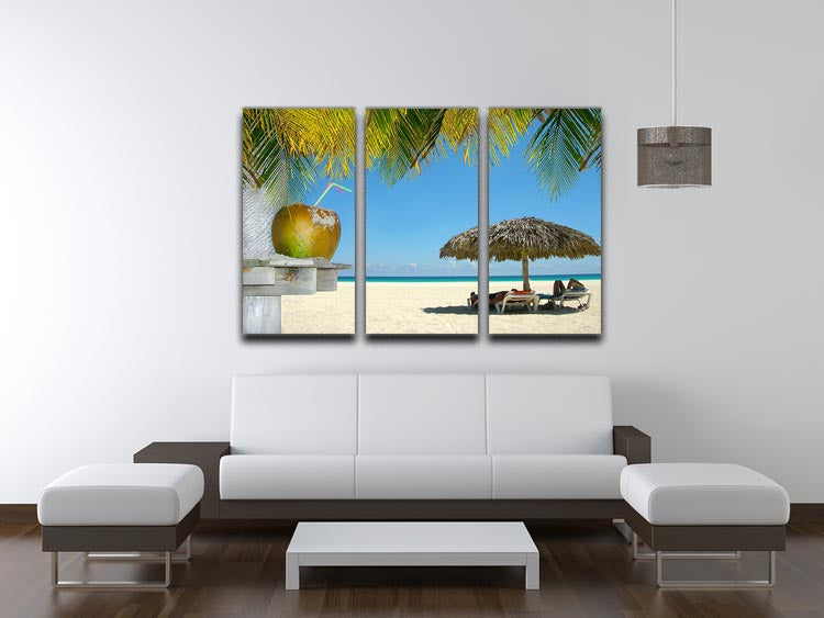 A beautiful 3-panel canvas depicting people relaxing under tropical huts surrounded by coconuts, perfect for home decor.