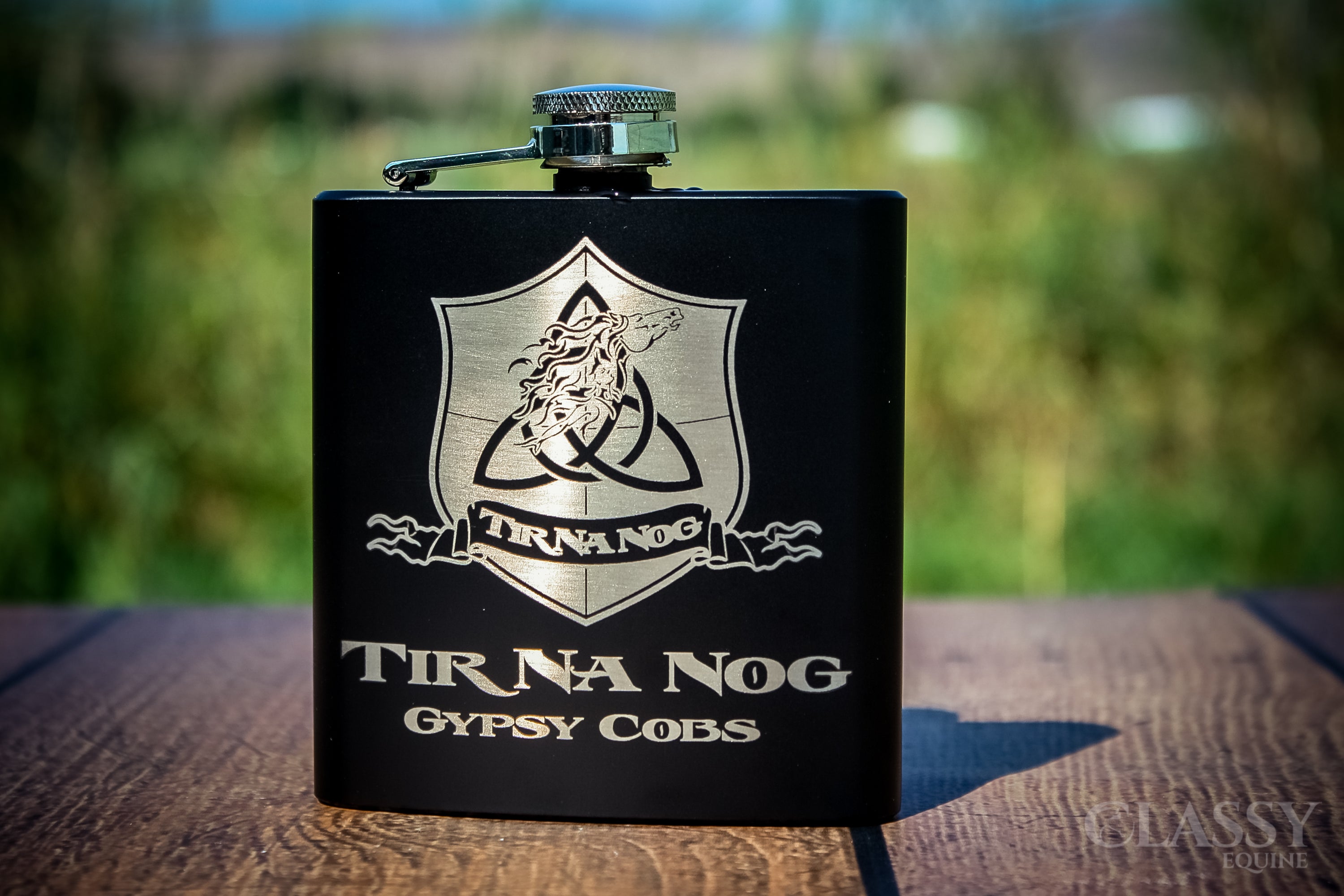 Personalized black stainless steel 6 oz hip flask with custom engraving options.