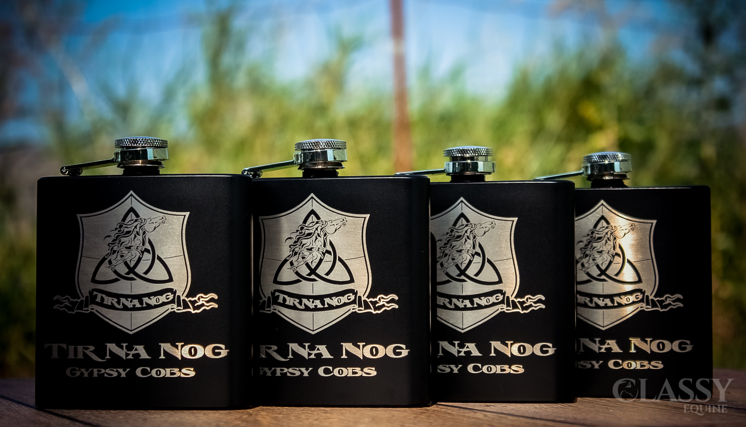 Personalized black stainless steel 6 oz hip flask with custom engraving options.