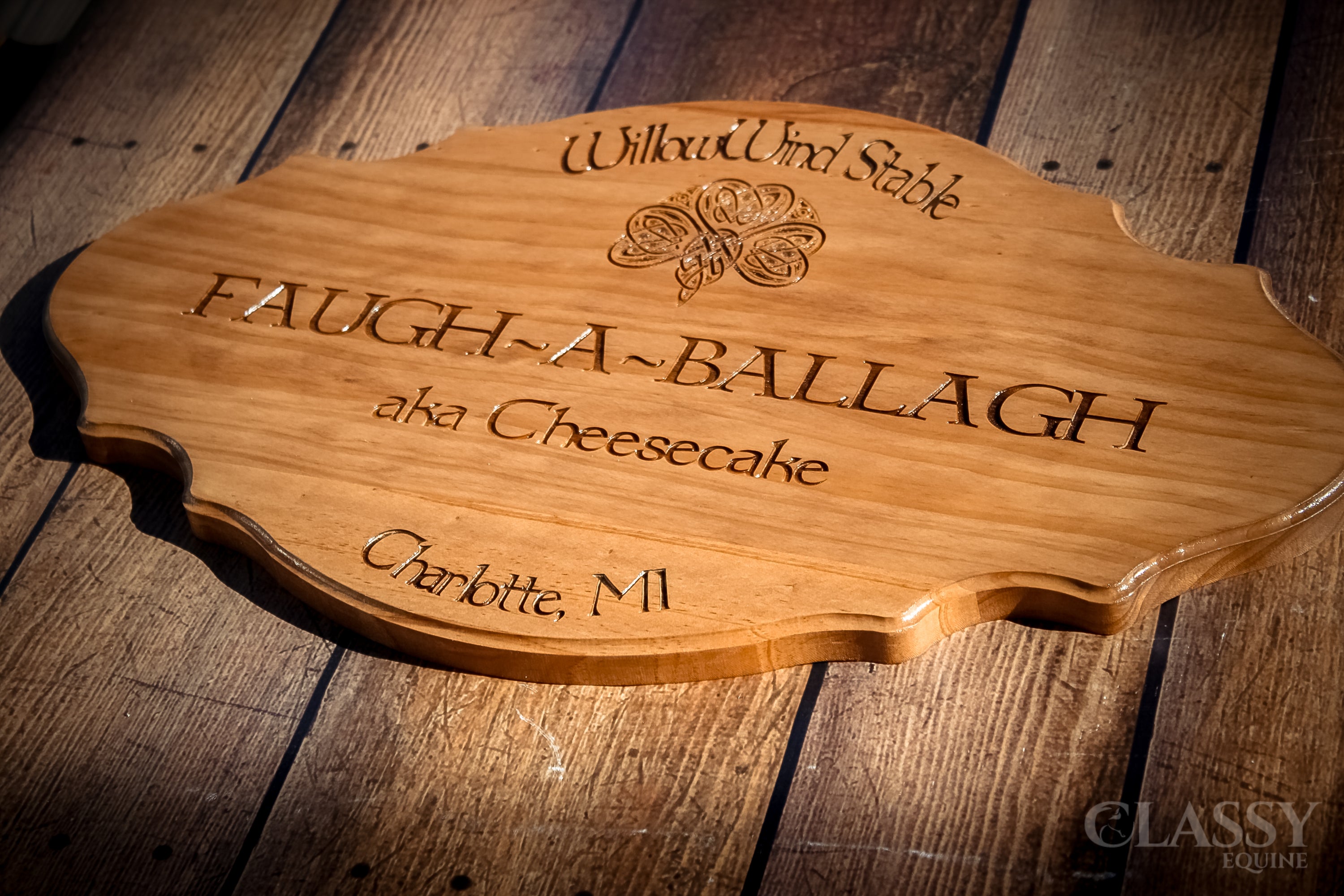 Personalized wooden stall door plaque in French provincial style, featuring custom engraving for horse's name and farm logo.