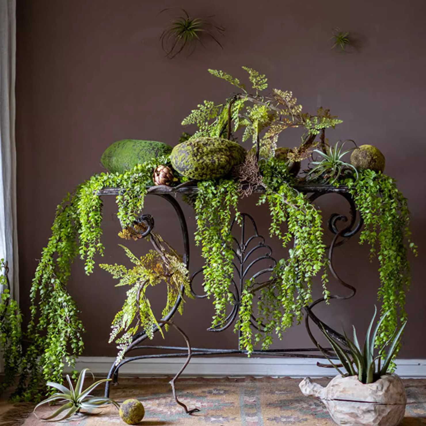A detailed view of the Petite Foliage Weeping Fern Sprig, showcasing its lush green leaves and realistic texture, perfect for home decor.