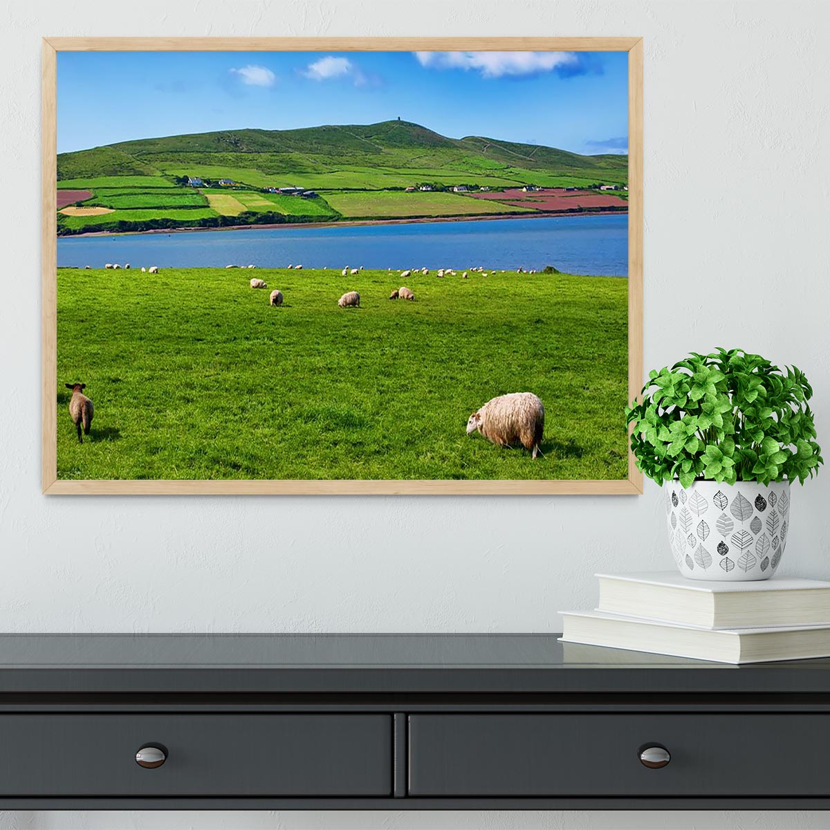 Framed print of a sheep in a rural landscape, showcasing vibrant colors and high-quality craftsmanship.
