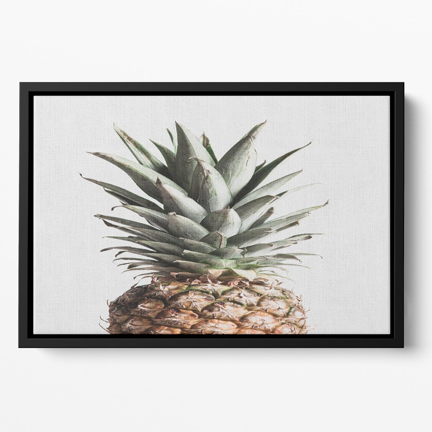 A vibrant pineapple design on a floating framed canvas, showcasing bright colors and elegant craftsmanship.