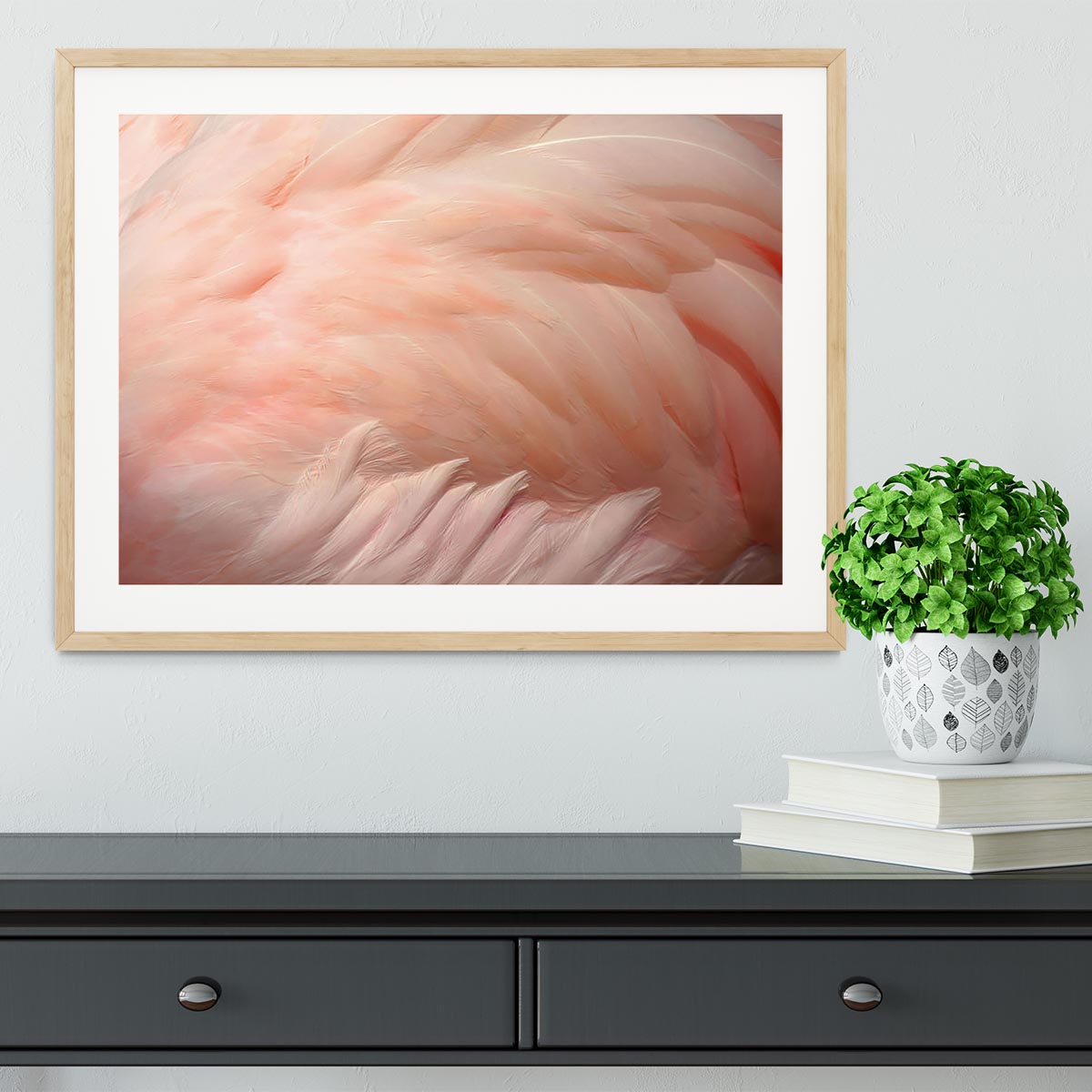 A beautifully framed print of pink flamingo feathers, showcasing vibrant colors and intricate details, perfect for home decor.