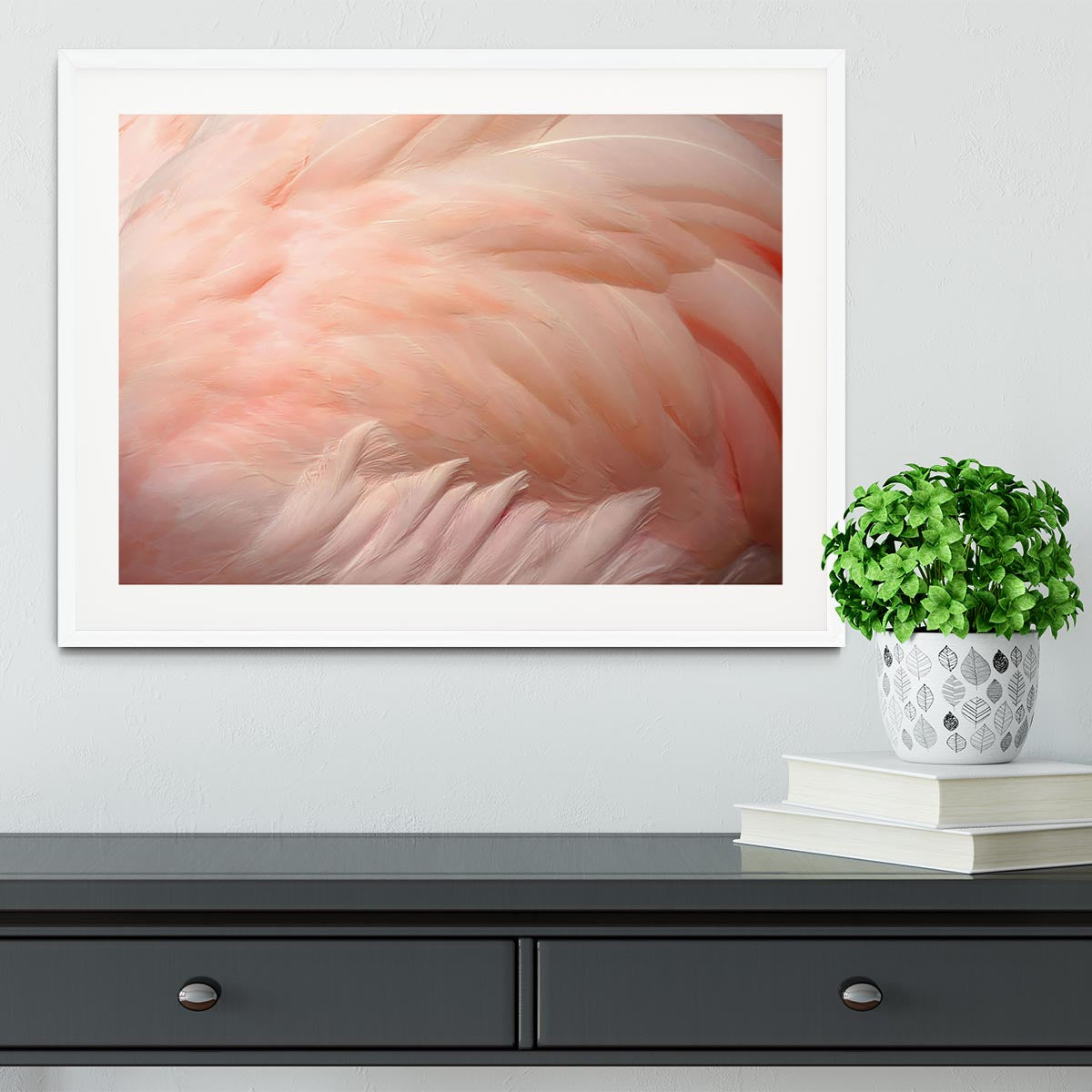 A beautifully framed print of pink flamingo feathers, showcasing vibrant colors and intricate details, perfect for home decor.