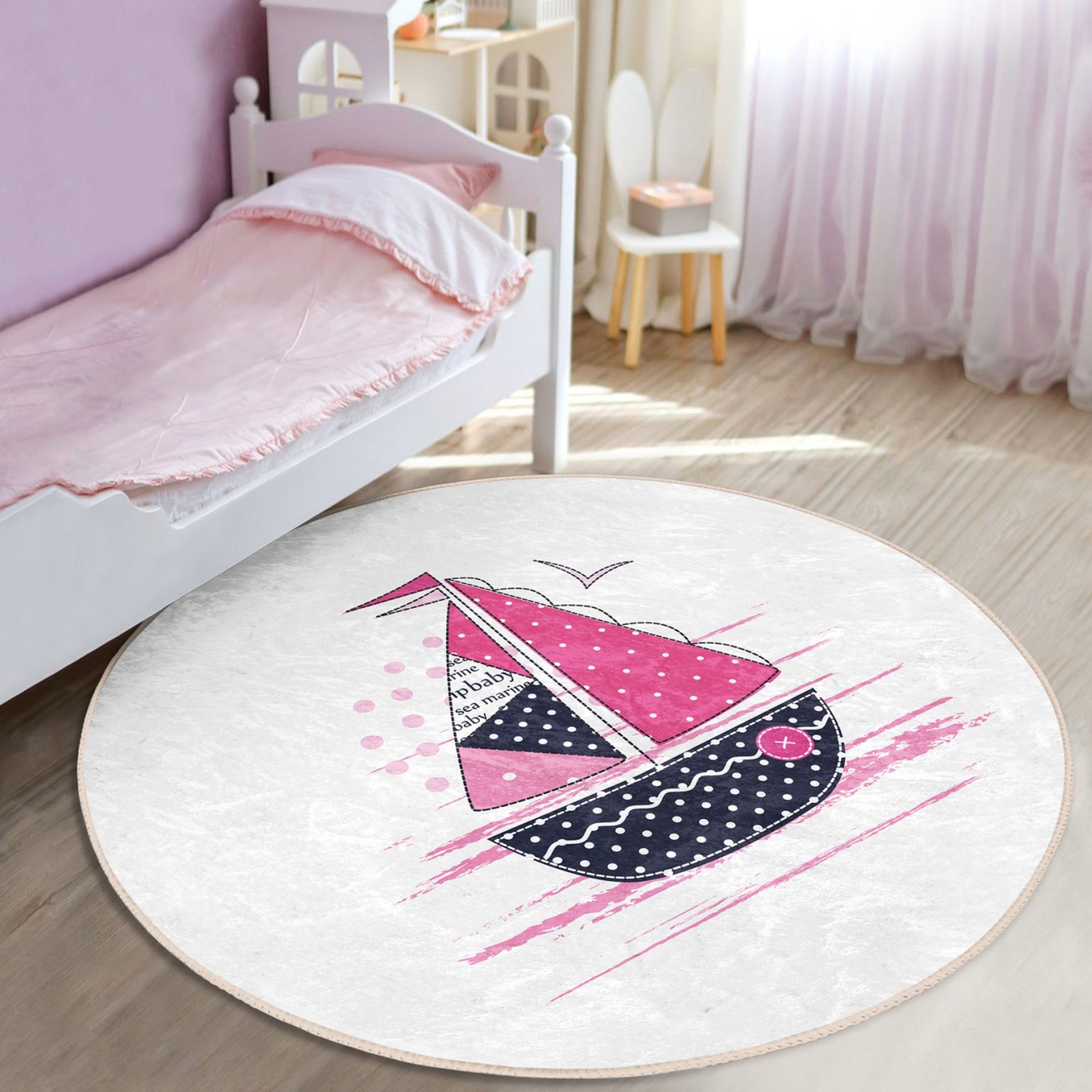 A colorful pink sailboat pattern rug designed for kids' rooms, showcasing vibrant colors and a soft texture, perfect for play areas.