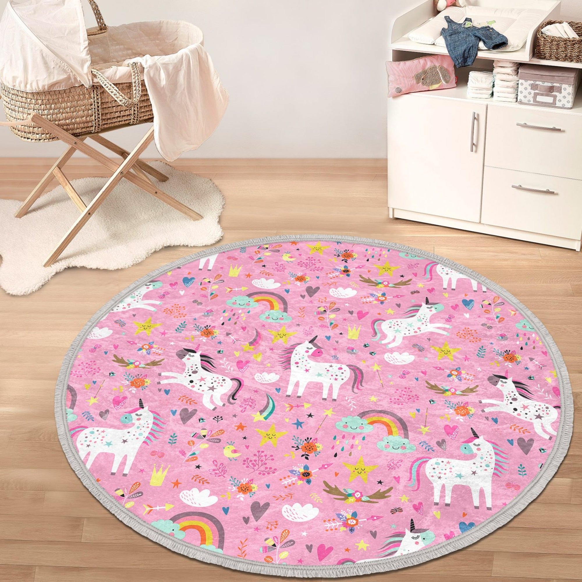 A vibrant pink round rug featuring a whimsical unicorn print, perfect for girls' rooms, made from soft velvet fabric with a non-slip backing.
