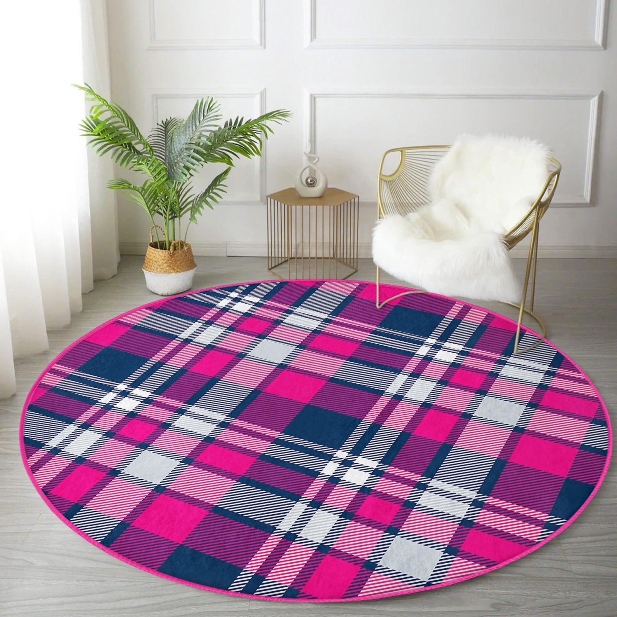 A stylish round rug featuring a pink-purple plaid pattern, showcasing its soft texture and modern design, perfect for home decor.
