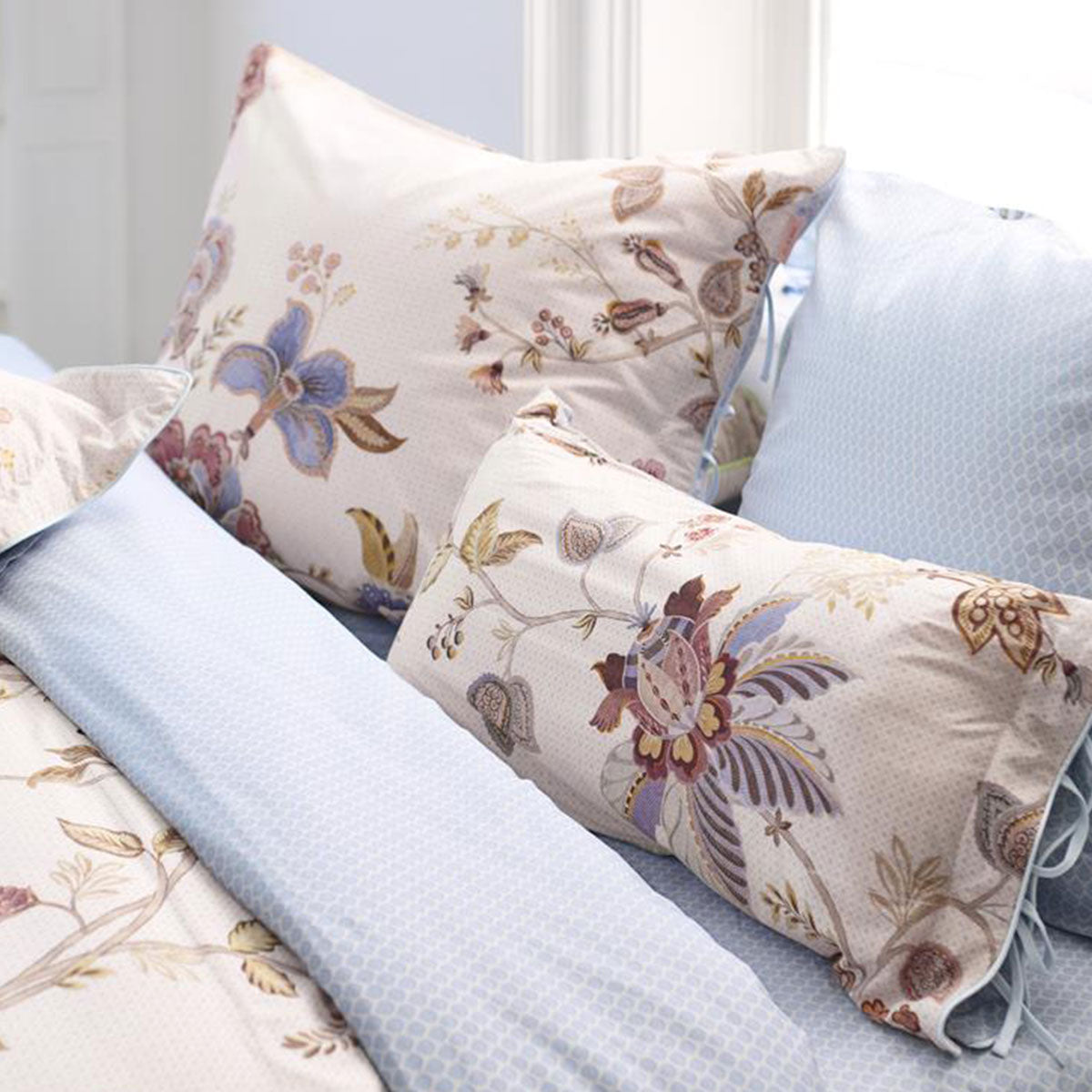 PIP Studio Cece Fiore White Cotton Quilt Cover Set featuring large floral designs and colored piping, perfect for a king-sized bed.