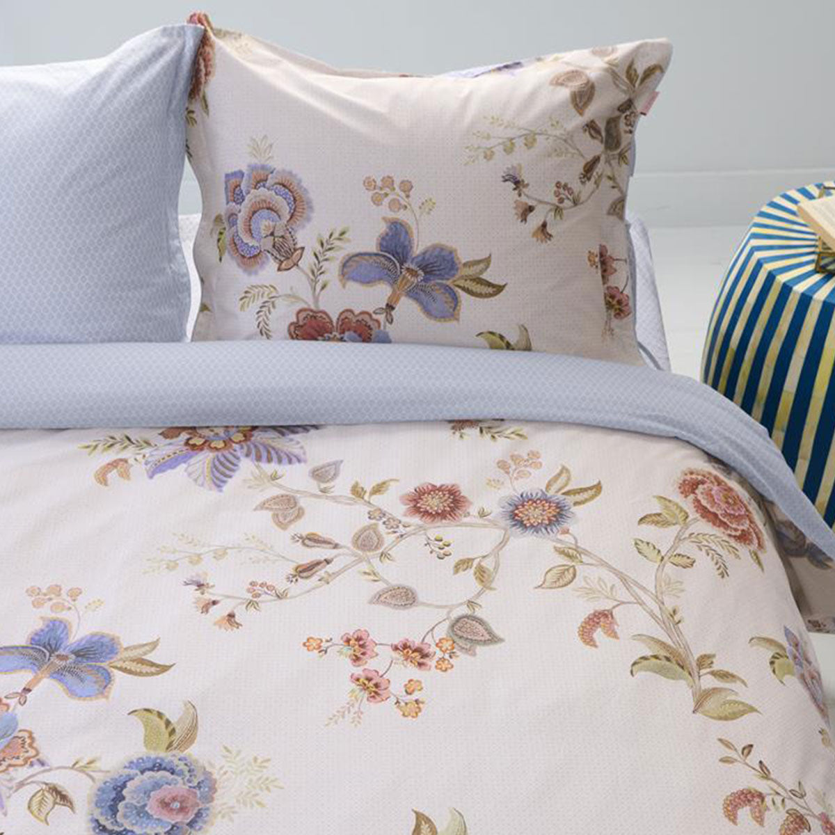 PIP Studio Cece Fiore White Cotton Quilt Cover Set featuring large floral designs and colored piping, perfect for a king-sized bed.