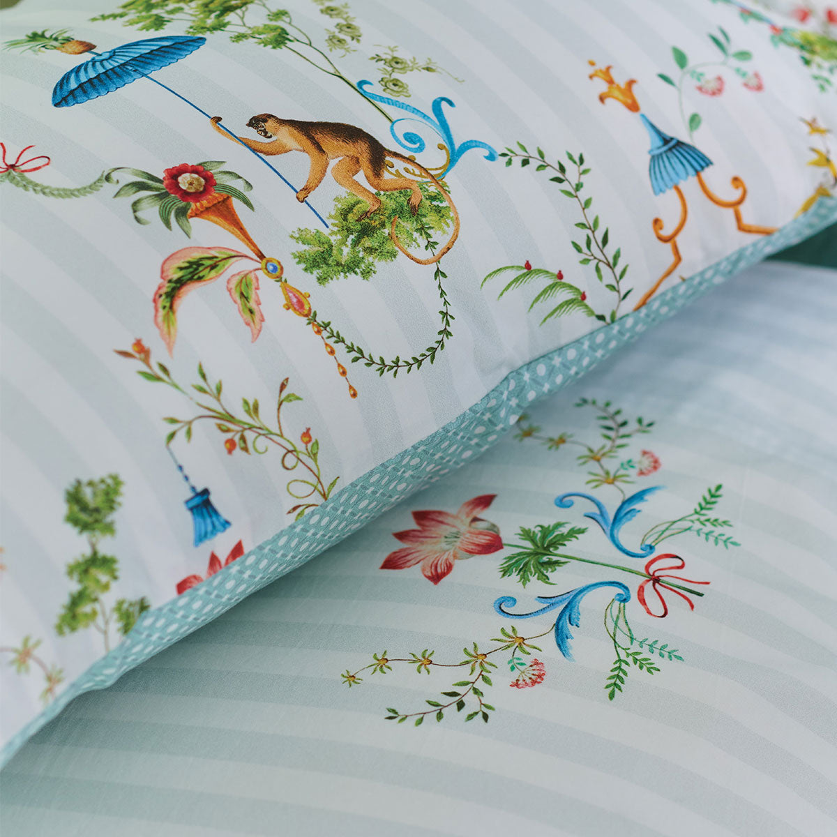 PIP Studio Singerie White Cotton Quilt Cover Set featuring vibrant bird and monkey designs in a flower-filled summer house.