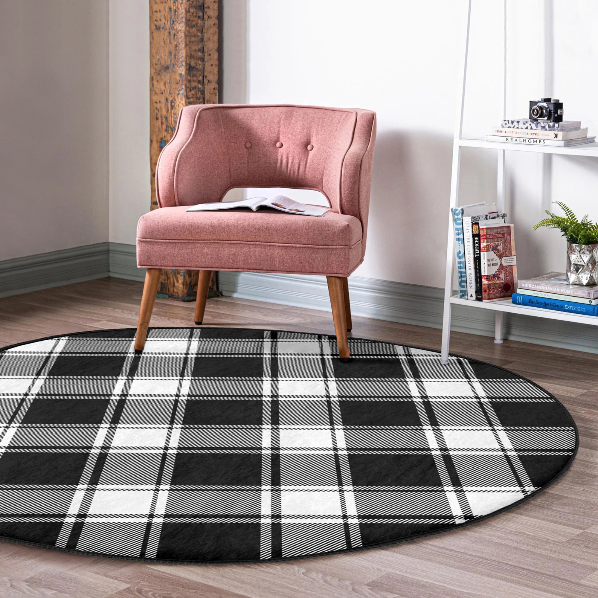 A stylish plaid round rug in soft velvet fabric, showcasing a vibrant pattern suitable for living rooms and bedrooms.