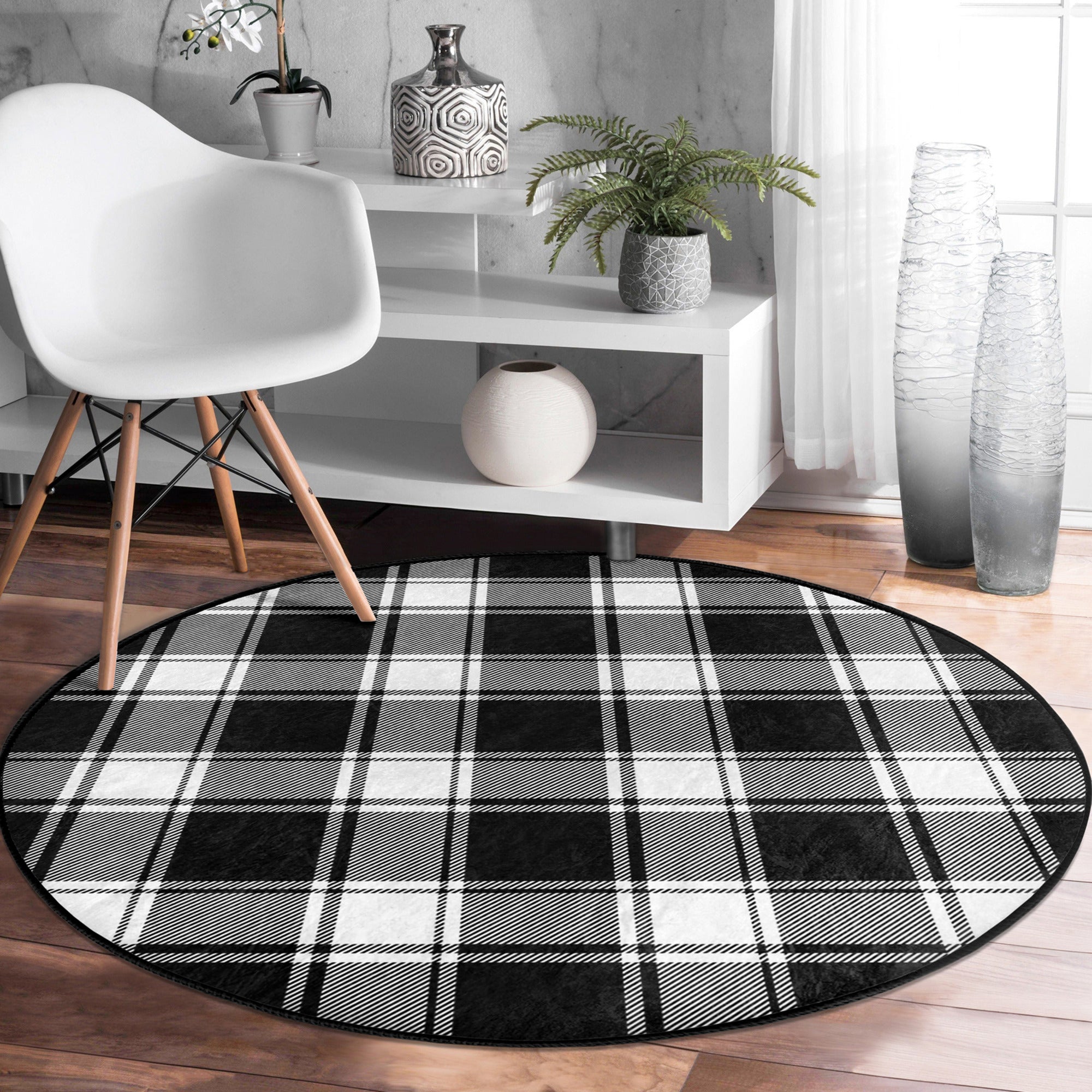 A stylish plaid round rug in soft velvet fabric, showcasing a vibrant pattern suitable for living rooms and bedrooms.