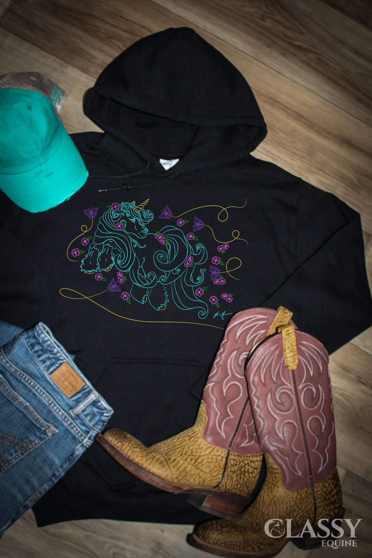 Plumeria Unicorn Hooded Sweatshirt featuring a whimsical unicorn design, double-lined hood, and pouch pocket, perfect for casual wear.