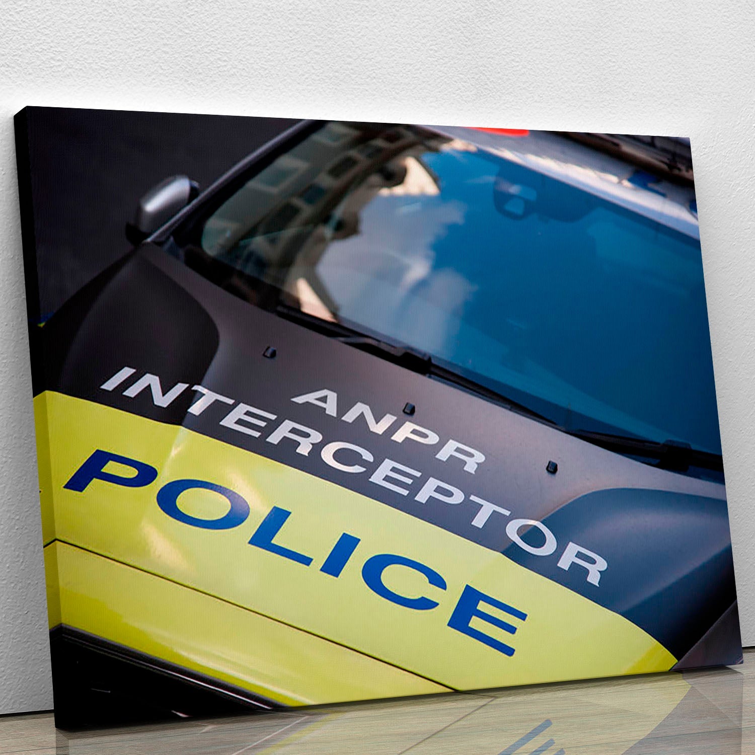 A vibrant canvas print of a police car, showcasing its sleek design and colors, perfect for home or office decor.