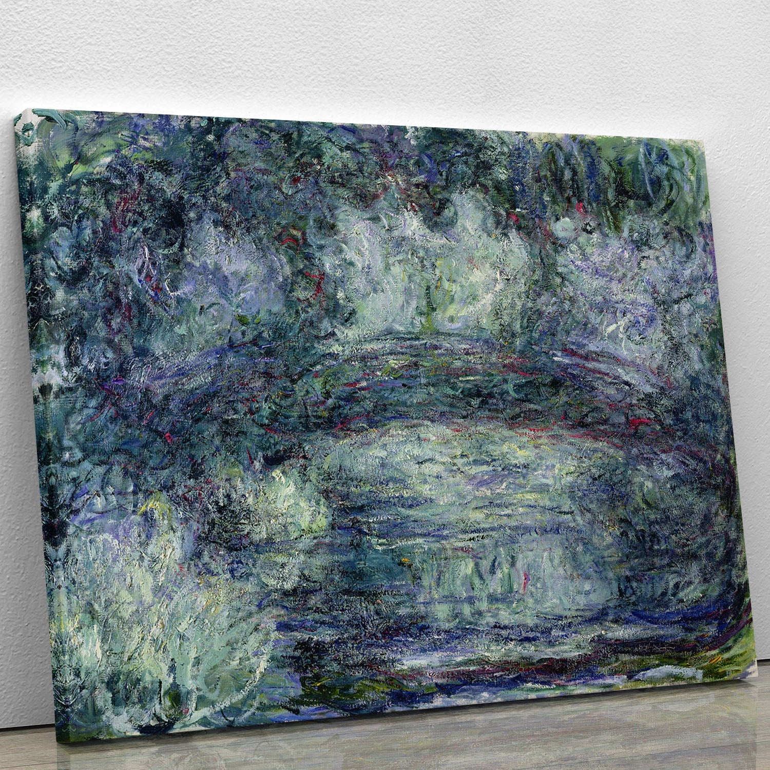 Canvas print of Pont Japonais Japanilainen silta by Monet, showcasing a serene Japanese bridge surrounded by lush greenery.