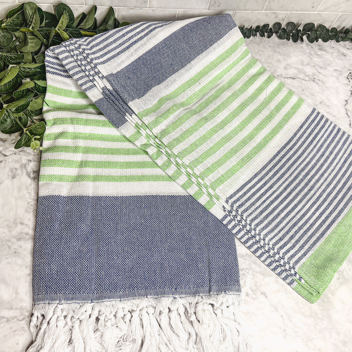 Pop of Summer Towel made from 100% Turkish cotton, featuring blue and green stripes with decorative tassels.