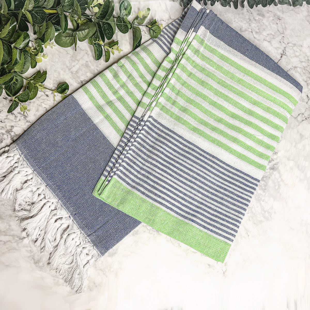 Pop of Summer Towel made from 100% Turkish cotton, featuring blue and green stripes with decorative tassels.