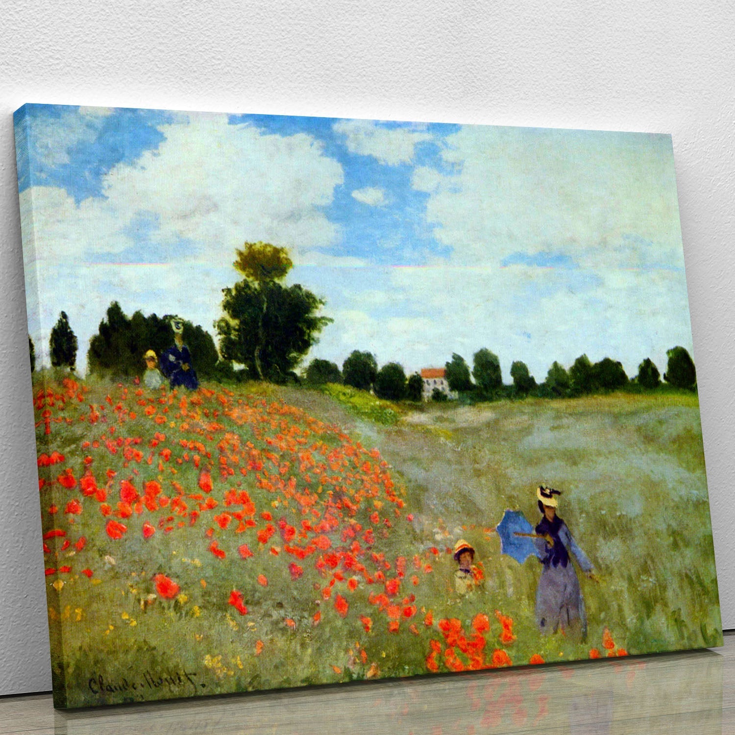 A vibrant canvas print of Monet's Poppies, showcasing bright red flowers in a lush green field under a blue sky.