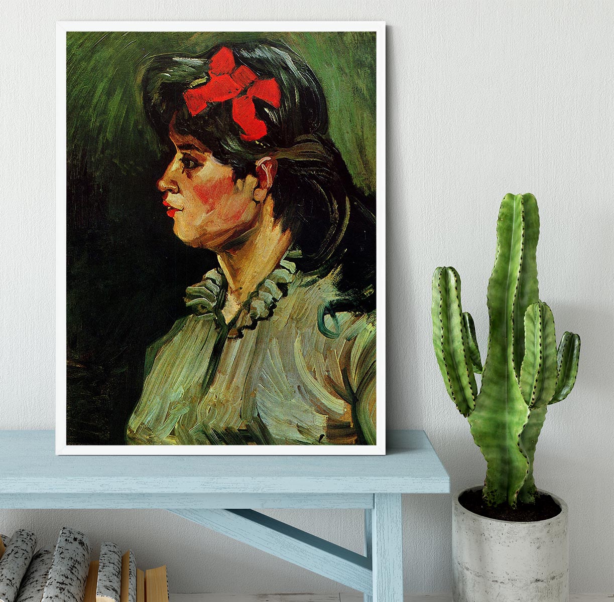 Framed print of Van Gogh's Portrait of a Woman with Red Ribbon, showcasing vibrant colors and elegant framing.