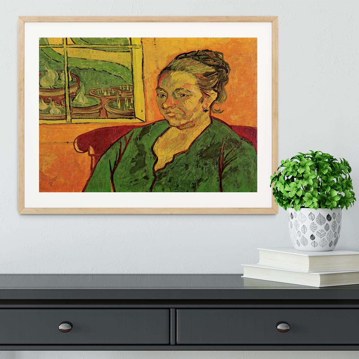 Framed print of Van Gogh's Portrait of Madame Augustine Roulin, showcasing vibrant colors and intricate details.