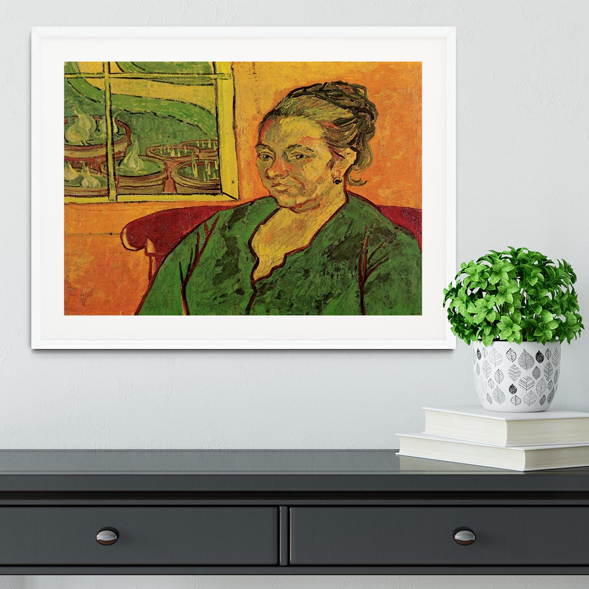Framed print of Van Gogh's Portrait of Madame Augustine Roulin, showcasing vibrant colors and intricate details.