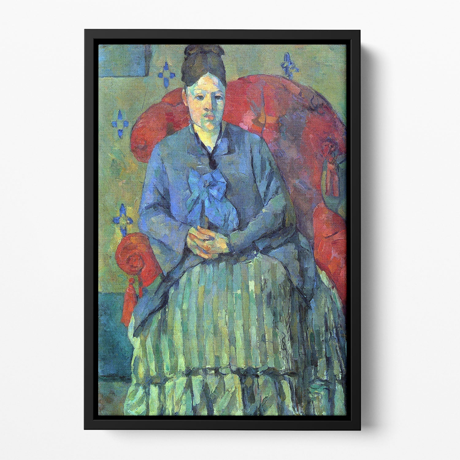A vibrant portrait of Mme Cezanne seated in a red armchair, elegantly framed in a floating frame, showcasing abstract art.