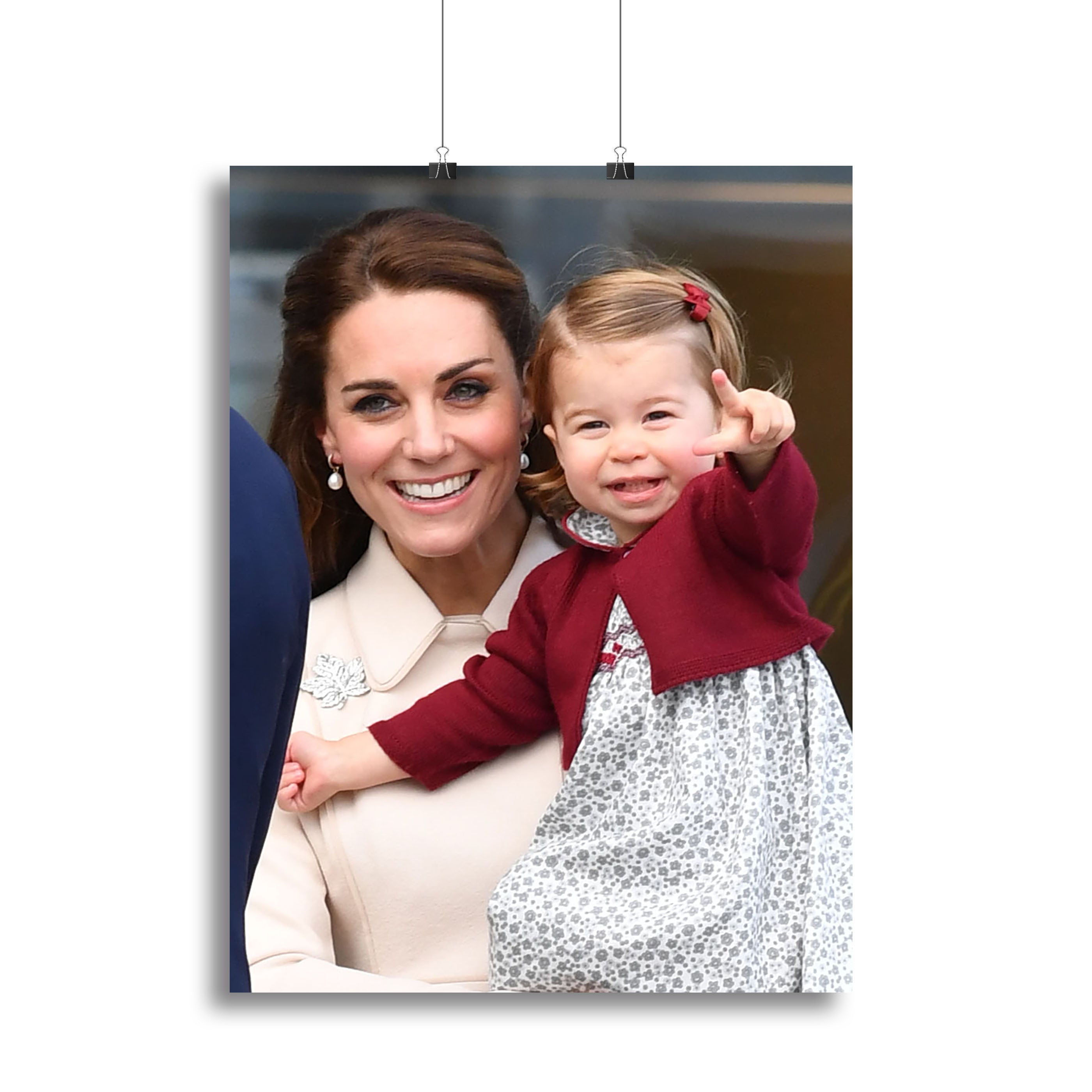Canvas print of Princess Charlotte held by her mother Kate Middleton, showcasing a heartwarming family moment.